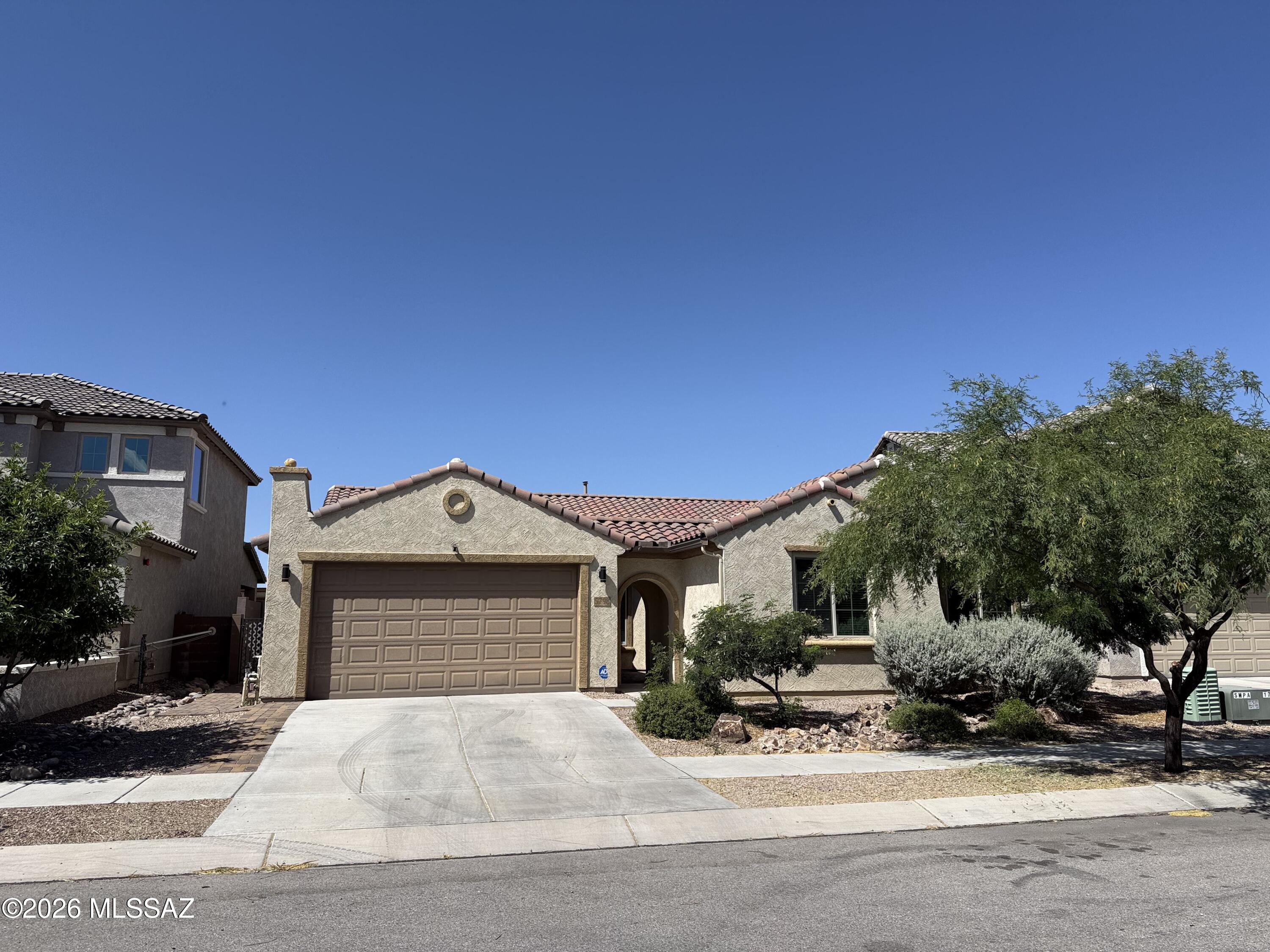 Looking for a large home with no rear neighbors? Look no further than this house that features a court yard entry, open split floor plan with a chefs delight kitchen, Espresso cabinetry w/crown molding. Double ovens, pull out shelves, upgraded range, large granite breakfast bar and island that opens to dining rm and great rm. Large walk in pantry too! 3 bedrooms and a den w/French doors. Large master with in-suite bath, linen closet, walk in closet, garden tub and shower and dual sinks. Hall bath has a linen closet and tub and 1/2 bath off of great room is a bonus. Back yard is stubbed for natural gas. This established newer community has a community pool, rec room, dog park an open spaces to enjoy throughout. All of this and on a cul-de-sac too! And Vail school district as well!