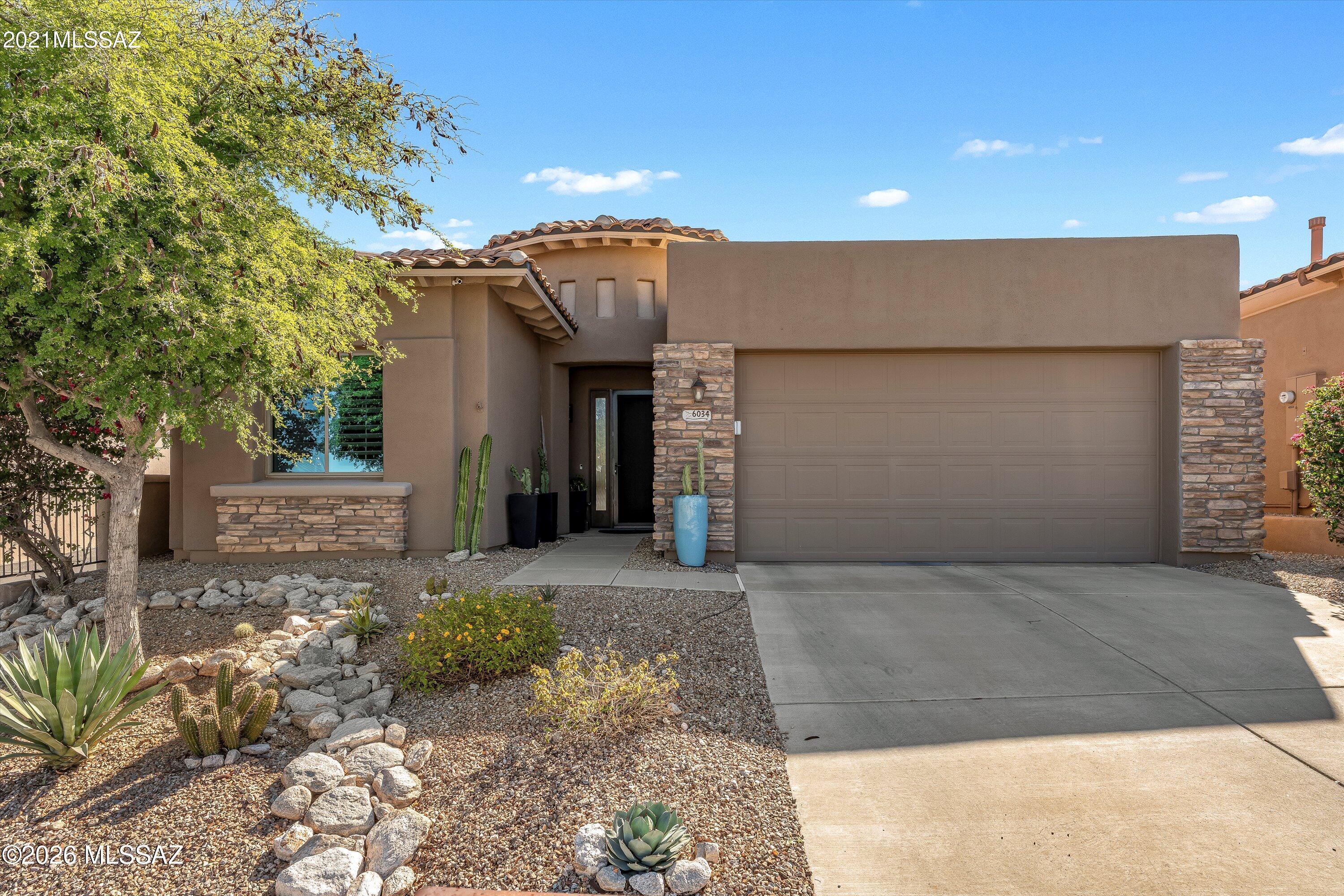 Nestled in the prestigious guard-gated enclave of Villages of La Paloma, this elegant home offers refined desert living with breathtaking views of the Catalina Mountains, golf course, and city. Step through the new custom front door to a light-filled main living area, highlighted by soaring ceilings that create a bright and airy atmosphere. The open great room flows seamlessly into an expansive outdoor space, perfect for entertaining or enjoying a morning latte beneath the pergola while taking in the stunning Catalina views. Mature citrus trees and manicured desert landscaping capture the beauty of Southern Arizona, providing a warm and welcoming arrival home. The well-appointed kitchen flows seamlessly into the main living space, creating an ideal setting for entertaining or relaxed everyday living. The spacious primary suite offers a private retreat with a walk-in closet and views of the Catalinas.
Residents enjoy beautifully maintained grounds and convenient access to world-class golf, hiking, and upscale shopping and dining at La Encantada. This is foothills living at its finest. Lock and leave or enjoy year-round. Move-in ready!  
Improvements in the last 5years include:
HVAC, Hot Water Heater, Windows, 2 New Patio Sliding Glass Doors which includes opening up window area to fit the 8' slider, Pergola, Artificial Turf, Engineered Wood Flooring, 2nd Bath, Laundry Room(added a sink), New Custom Front Door w/stainless security screen, new garage door opener and Exterior Paint.
Broker owned.
