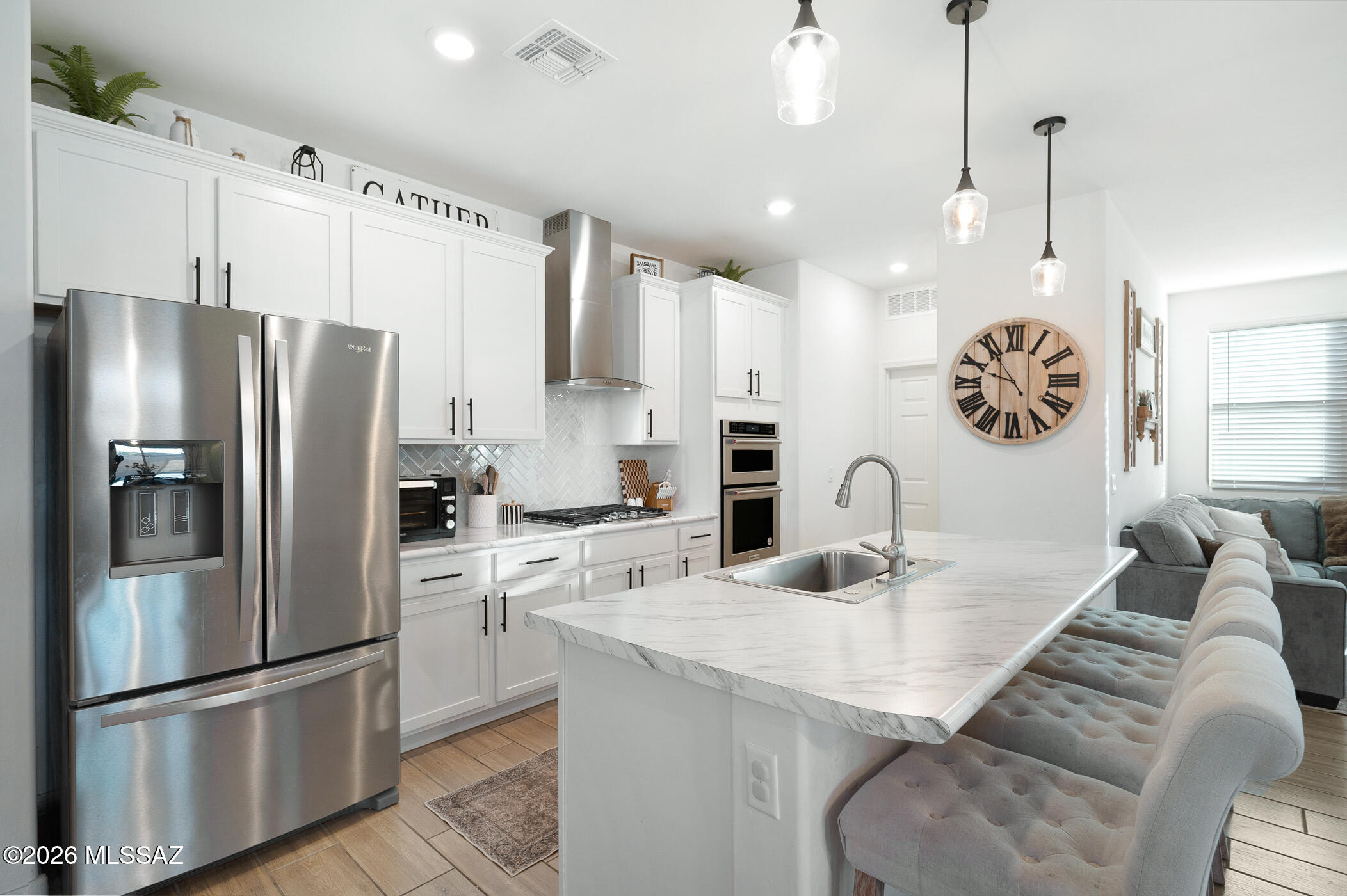 Welcome to 12313 N Sutter Drive--where thoughtful upgrades meet everyday ease in one of Marana's growing communities. From the moment you step inside, you're greeted by a charming board-and-batten accent wall that sets the tone for a home that's anything but basic. Extended tile flooring runs throughout, giving you a clean, cohesive look that's as low-maintenance as it is stylish. The kitchen is a standout with its custom backsplash and open-concept design that flows effortlessly into the living and dining areas--perfect for everything from weeknight dinners to weekend hosting. Step outside to a finished backyard ready for relaxing, entertaining, or just enjoying a little extra breathing room--with only two neighboring homes, you get a sense of openness that's getting harder to find. And let's talk location--because it delivers. You're just minutes from the new Fry's Marketplace, surrounded by shopping and dining, with easy access to parks, the neighborhood splash pad, and The Loop for biking, walking, and getting outside. Smart layout, stylish upgrades, and a location that makes life easier--this one checks all the boxes. Come see it in person and feel the difference.