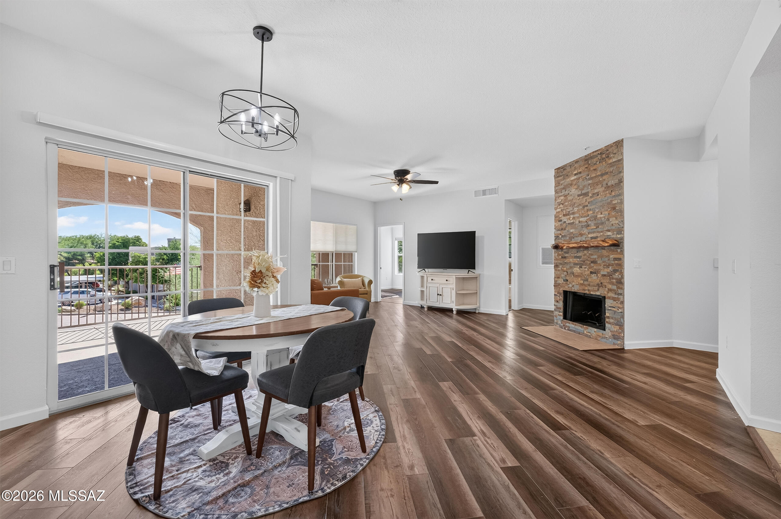 Seller will consider offers between 299,000-325,000 depending if you want the garage or not. This beautifully updated upper level corner condo featuring three bedrooms and two bathrooms, carport & garage included. Soaring 9 foot ceilings and abundant natural light create an open, inviting feel, while the cozy fireplace adds warmth and charm. The spacious primary suite offers a generous walk in closet and relaxing garden tub. New flooring and paint gives the home a fresh, modern look throughout. Enjoy your morning coffee or Arizona evenings on the covered patio, then cool off in the sparkling community pool. A full size washer and dryer add everyday convenience. Ideally located near popular dining, shopping, hiking, and all that Oro Valley has to offer. Perfect as a full time residence, seasonal retreat, or lock and leave getaway