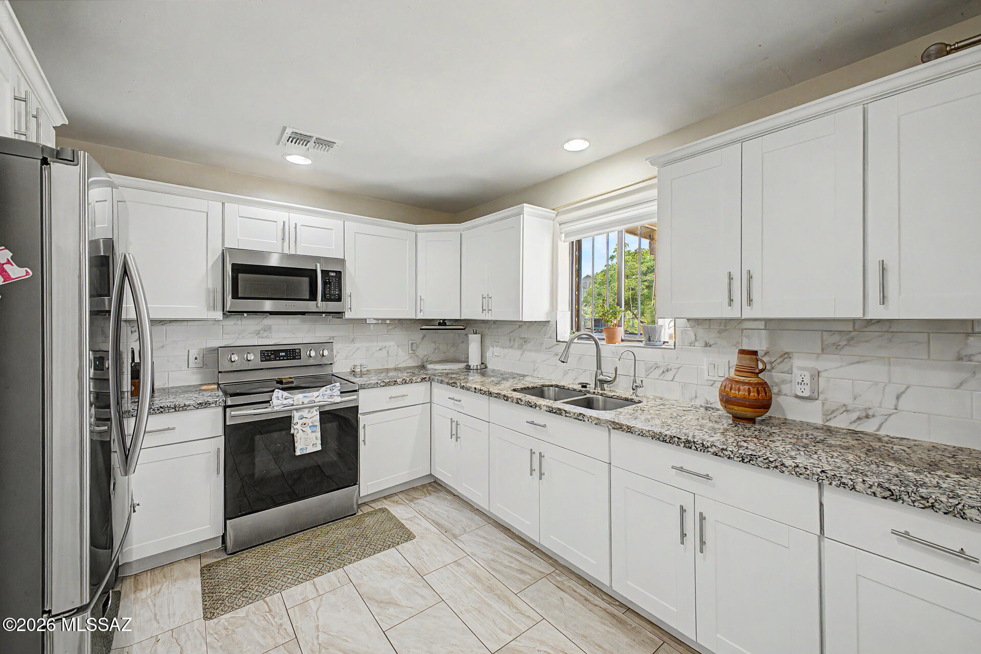Beautiful home in the Diablo Village Estates subdivision featuring 4 bedrooms and 2 bathrooms with stylish tile flooring, granite countertops, stainless steel appliances, and updated finishes throughout the interior. Enjoy a spacious and functional layout designed for comfortable living and entertaining. Step outside to a large backyard with a covered patio offering endless possibilities to create your dream outdoor space, add a pool, garden, playground, or entertainment area. No HOA gives you the freedom and flexibility to truly make this property your own. A great opportunity to own a move in ready home with space, charm, and potential.
