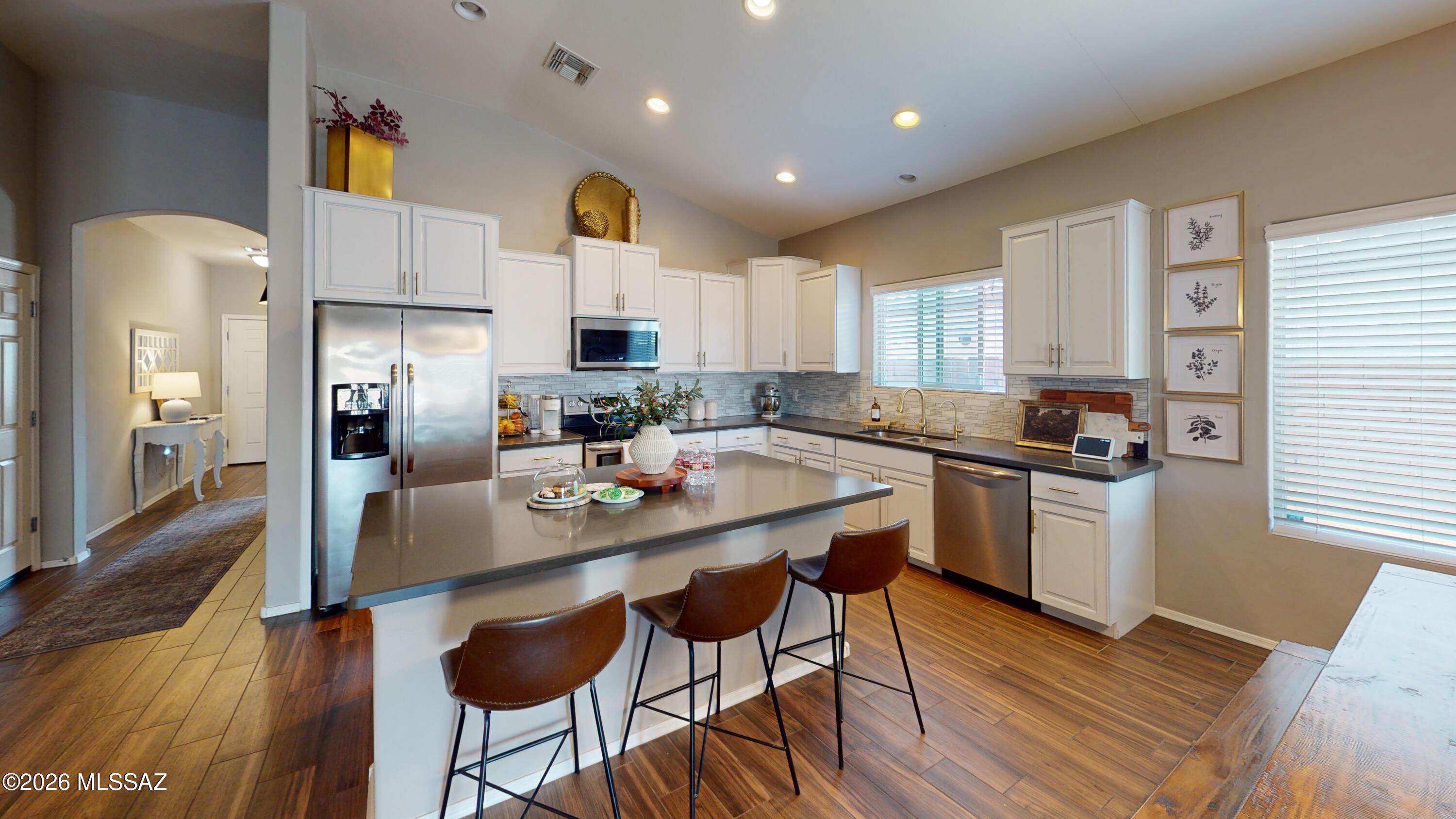 Spacious single-story home in Saguaro Bloom offering 5 bedrooms, 3 baths and a desirable split-bedroom floor plan. Built in 2017, this home features an open-concept layout with generous living, dining and kitchen areas designed for comfortable everyday living and entertainment. The split floor plan provides separation between bedroom areas and added flexibility for a home office, guest room or additional living space. Enjoy a backyard that backs to a common area, providing additional separation from neighboring homes directly behind the property. Additional features include a 2-car garage and convenient access to Saguaro Bloom community amenities, including parks, pools and recreation areas. Located in Marana w/ convenient access to shopping, dining and area amenities. Offered at $469,900