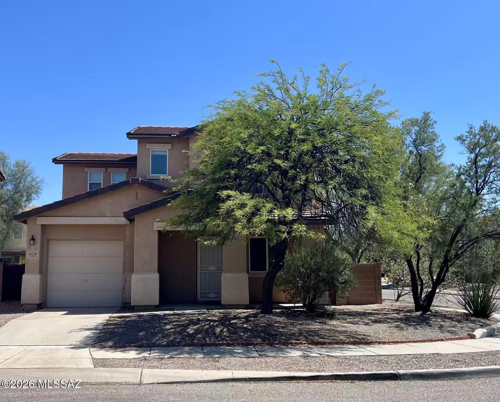 Charming Corner-Lot Home and nestled in the heart of the sought-after Riverhaven neighborhood, it sits on a spacious corner lot with a generous backyard. The main level features an open kitchen, with convenient laundry room, and abundant storage throughout. The first floor also boasts a fully permitted additional living room, bedroom, and bathroom--perfect for guests, a home office, or multi-generational living. Upstairs, you'll find three comfortable bedrooms and two full bathrooms. Designed for easy maintenance, the home features durable 18'' tile in the main downstairs living areas and stylish wood-look vinyl flooring in all bedrooms. All appliances convey. Minutes from local parks, the riverwalk, shopping, dining, the U of A and UMC.  Great for start home or investment!