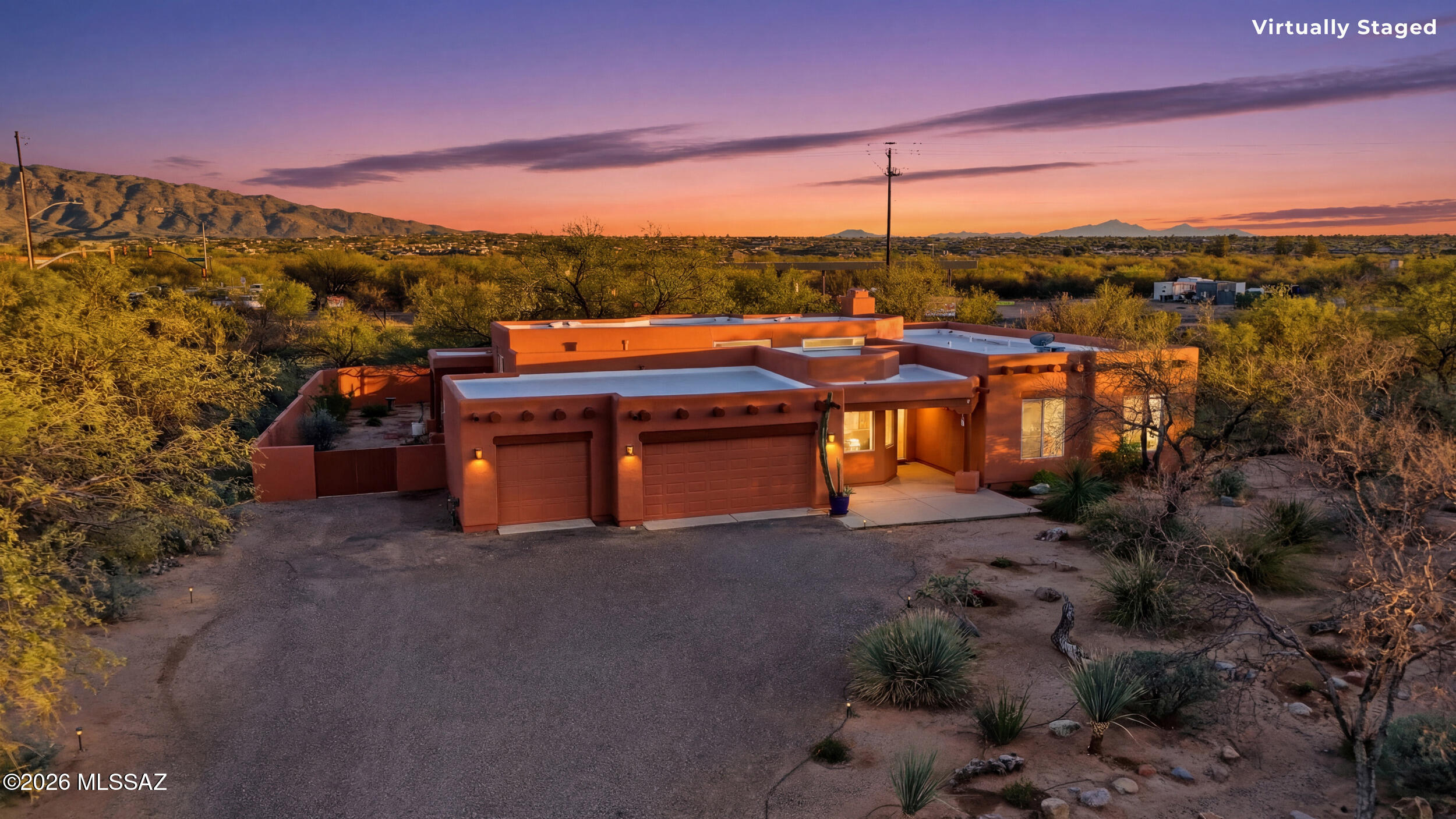 Situated on nearly an acre in the desirable Tanque Verde area, this 3-bedroom, 2-bath Santa Fe-style home offers 2,352 sq ft of comfortable living with beautiful desert surroundings. Built in 1998, the home features 13' ceilings with clerestory windows and polished concrete floors. The interior includes two living areas plus a flexible bonus room ideal for a home office, den, or formal dining space. The kitchen and bathrooms feature classic Mexican tile, while a beehive gas fireplace adds authentic Southwestern charm.
Outside, enjoy a private desert oasis with a swimming pool, two covered patios, and mature native landscaping on a spacious ~0.93-acre lot. Additional highlights include a 3-car garage and mountain views in a quiet neighborhood. A rare opportunity to enjoy privacy and space.