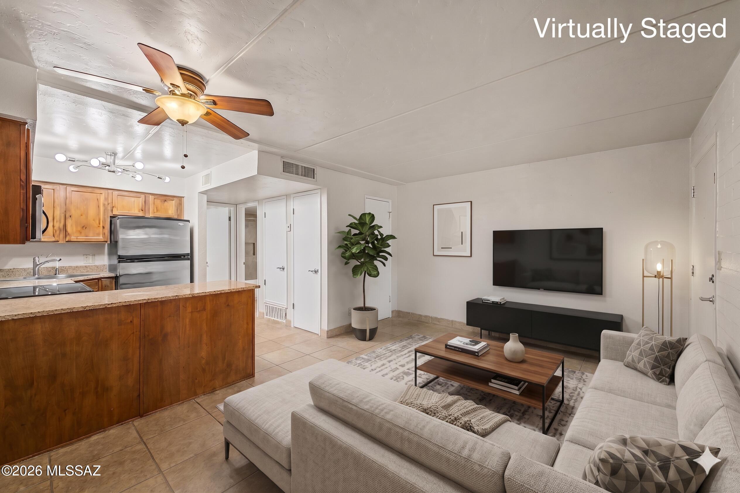 Seller will accept or counter offers between $140,000 and $150,000. Matterport & Floor Plan available Call Listing Agent For Details. Discover this move-in ready ground-level condo at 55 N Cherry Ave, Unit 114, ideally located near the University of Arizona in Tucson 85719. This 546 sq ft 1-bedroom home features an open floor plan with durable tile flooring and neutral paint. The modern kitchen is equipped with stainless steel appliances, granite countertops, and warm wood cabinetry. Enjoy a spacious bedroom with a walk-in closet and a convenient in-unit stacked washer and dryer. Community amenities include a sparkling blue pool, bike parking, and designated parking spaces. Perfect for students, professionals, or investors seeking a low-maintenance lifestyle.