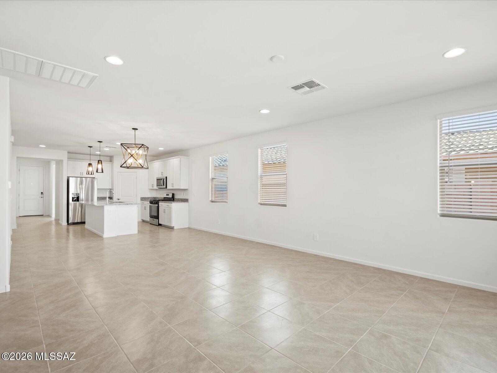 The Topaz floorplan features 4 bedrooms, 3 baths, and a teen room—ideal as an extra living space. Stylish finishes include white cabinets, quartz countertops, wood-look tile flooring, and natural-tone carpet from our Divine package. Located in Las Patrias at Star Valley Phase III in Tucson, AZ, this community offers easy access to I-10, downtown, and major employment centers. Enjoy amenities like bike/walking trails and playgrounds. This move-in ready home includes a washer, dryer, fridge, and whole-home blinds. Built with energy-efficient features for savings, comfort, and peace of mind.
