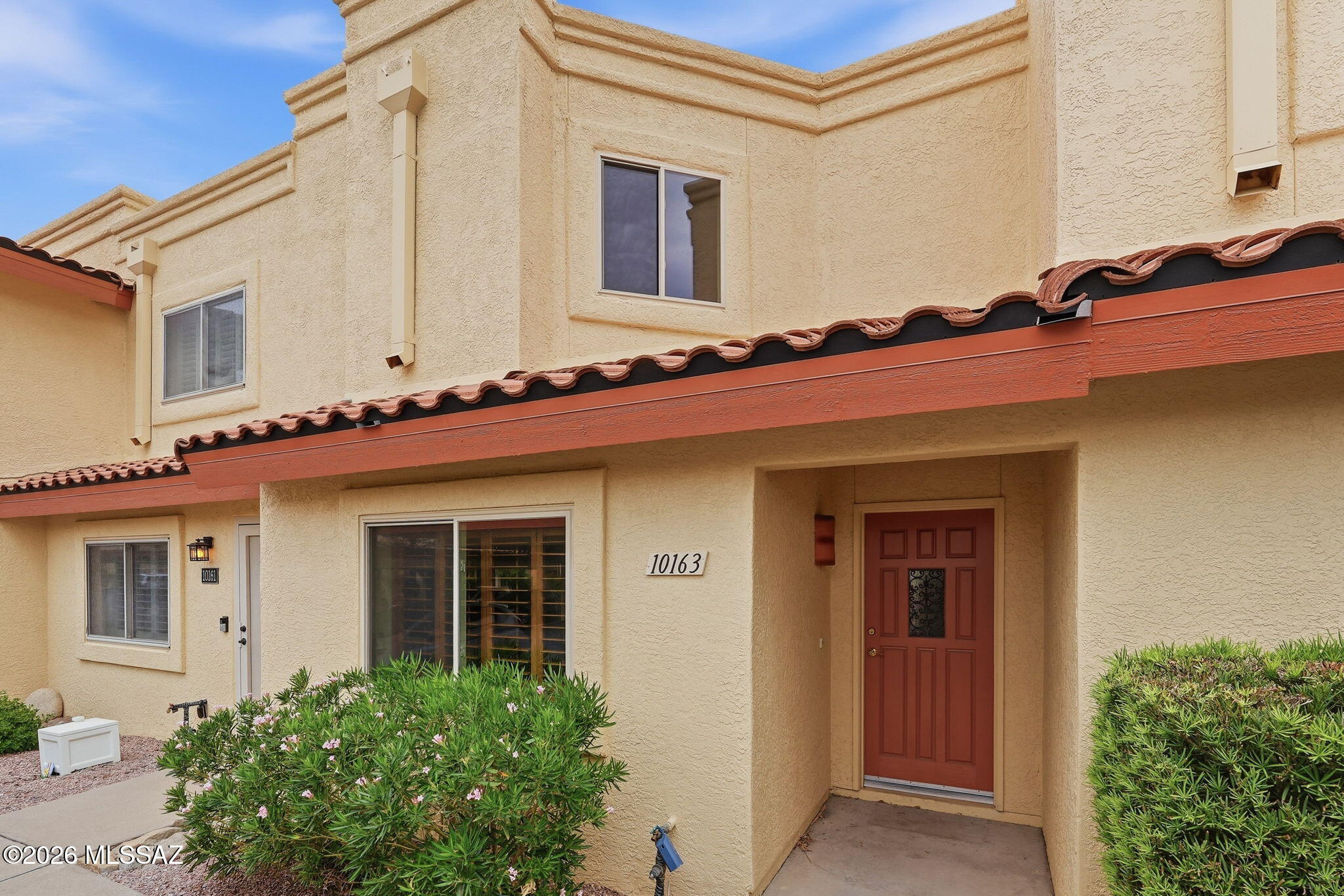 Mountain views, OWNED SOLAR & major updates already done! This inviting 2BR/2BA townhome offers comfortable, low-maintenance living with a bright, open-concept layout, desirable split-bedroom floor plan, built-in bookshelves, generous storage & abundant natural light. Enjoy peace of mind with HVAC replaced in 2024, water heater in 2022 & owned solar! Relax or entertain in the private backyard while taking in beautiful mountain views & Arizona skies. HOA adds even more value, covering the community pool, roof, street maintenance, garbage, sewer & front yard maintenance. Conveniently located near shopping, dining, parks & outdoor recreation. Easy Arizona living with the upgrades, views & lifestyle you've been looking for!