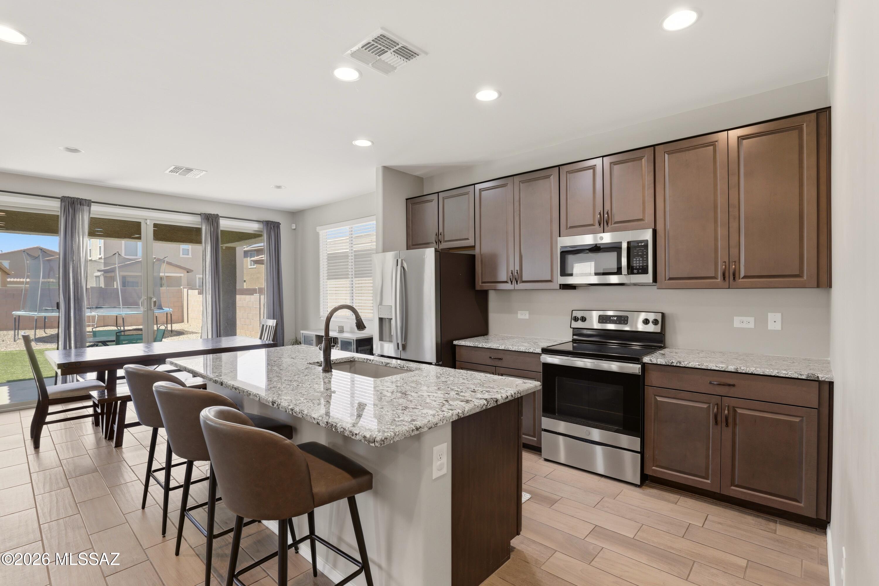 EXTREMELY LOW ASSUMABLE INTEREST RATE FOR VA BUYERS THAT YOU'LL WANT TO ASK ABOUT.

Welcome to this 2022-built home located in the highly sought-after Vail School District, minutes from I10 and DMAFB! This 5 bedroom, 3 bathroom property features an open floor plan with modern finishes and abundant natural light throughout. 
The backyard is thoughtfully landscaped, providing a comfortable outdoor space for relaxing or entertaining.
Situated in the La Estancia community, residents have access to amenities including pickleball courts, a pool, parks, and more.
This one won't last- come see it today!