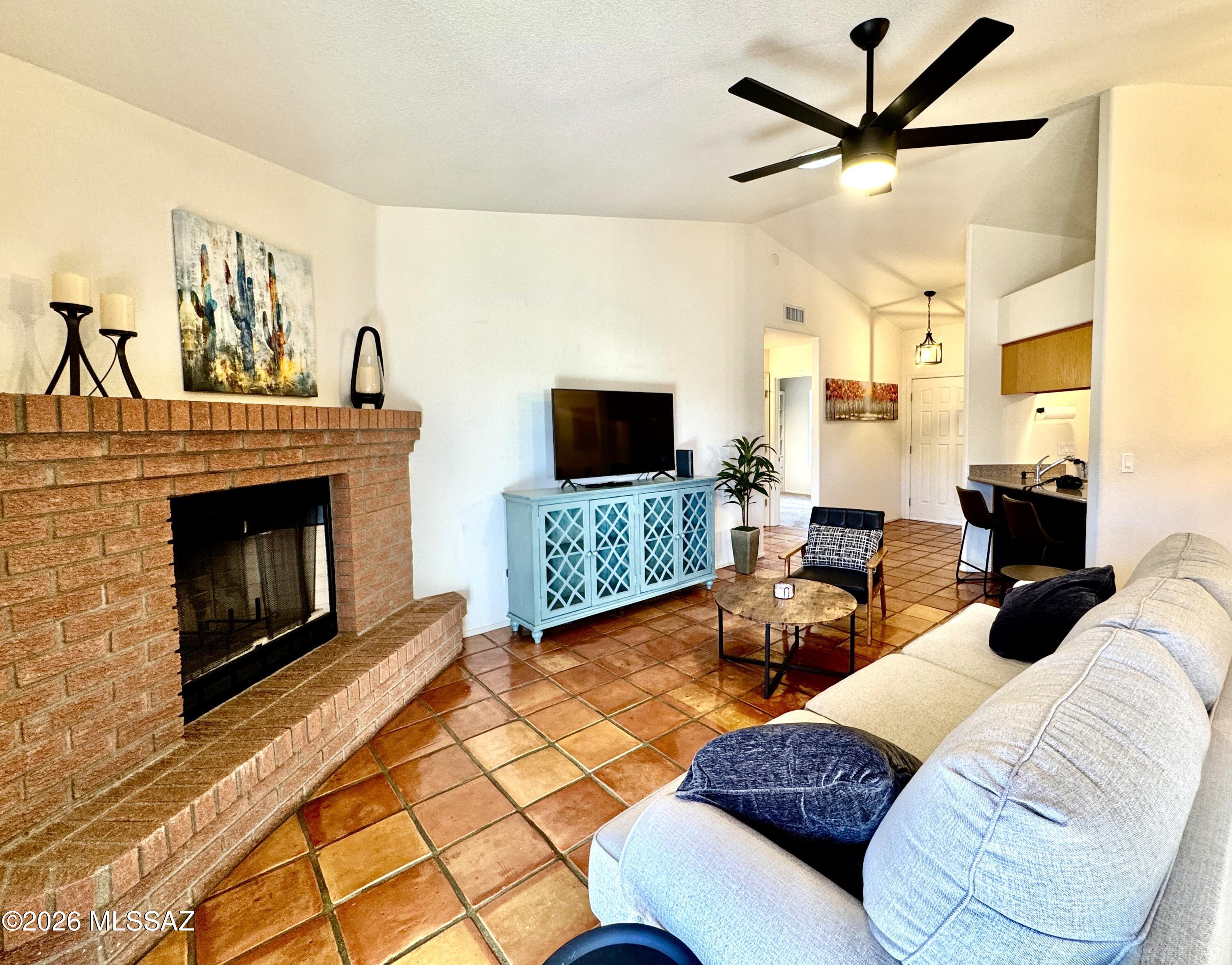 UNFURNISHED Rental - Welcome to this charming 3-bedroom, 2-bath home nestled in the Oro Valley, where comfort meets classic AZ desert beauty. This well-maintained property offers stunning mountain views & a thoughtfully landscaped yard featuring shrubs, decorative rock, gravel & flagstone accents. Step inside to a warm & inviting living space complete with a cozy wood-burning fireplace--perfect for relaxing evenings. The functional layout provides comfortable living with plenty of natural light throughout. Enjoy the outdoors in your private backyard oasis, featuring a covered patio ideal for entertaining or unwinding while taking in the surrounding desert scenery. Located in a desirable Oro Valley neighborhood, this home offers convenient access to shopping, dining & outdoor recreation.