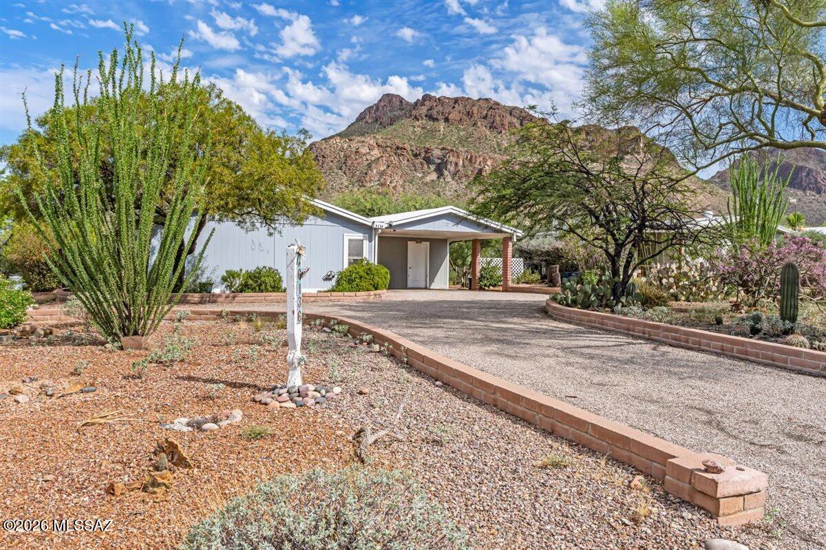 Enjoy stunning views of Tucson Mountain Park, the largest county park in the United States, right from this charming 2-bedroom, 2-bath plus a bonus room/office with an armoire that is included. With easy access to miles of well-maintained hiking and mountain biking trails, plus neighboring Saguaro National Park, outdoor adventure is just steps away. Inside, the kitchen offers abundant storage and a functional layout. Relax on the extended covered patio while taking in breathtaking desert and mountain views. Community amenities include a pool, spa, tennis courts, and pickleball courts, making this the perfect home for enjoying the Arizona lifestyle.