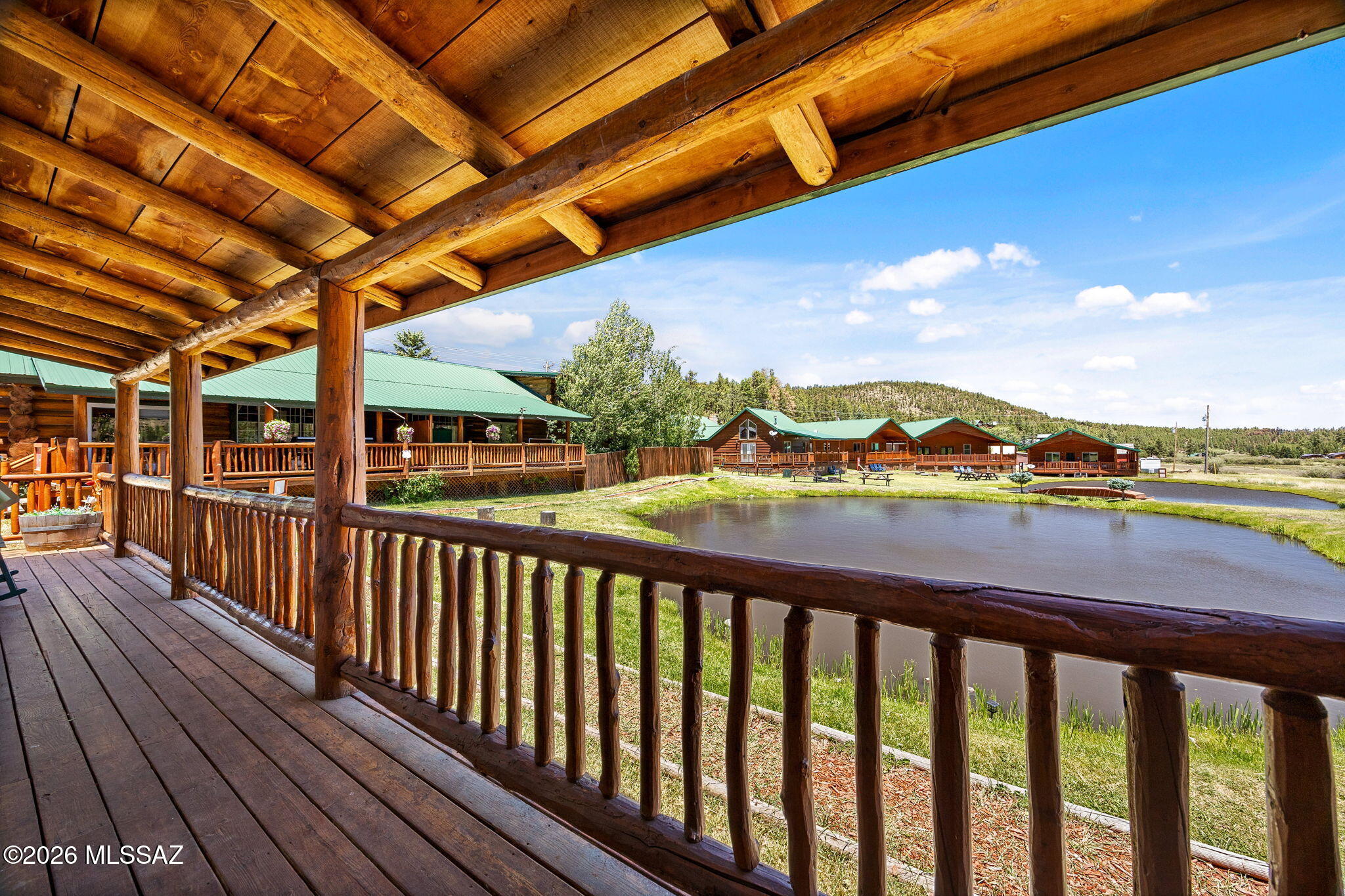 INVESTMENT OPPORTUNITY - GREER LODGE RESORTS - AFFORDABLE 1 BEDROOM & 1 BATH WITH GREAT ROOM/KITCHEN. ADJACENT TO NATIONAL FOREST & DIRECT VIEWS/ACCESS TO (2) STREAM FED TROUT PONDS. THIS CONDO/CABIN HAS AN ADJOINING WALL AND IS CONSTRUCTED OF 20'' PEELED LOGS WITH TONGUE AND GROOVE PINE & DRYWALL. BEDROOM FEATURES A KING BED, WALK IN CLOSET & ENSUITE FULL BATHROOM & PRIVATE ENTRY TO THE FRONT PORCH. VAULTED CEILING WITH EXPOSED LOG BEAMS. PROPANE
WALL HEAT. (SLEEPS 4) CABIN IS COMPLETELY FURNISHED WITH KITCHEN APPLIANCES, BIG SCREEN TVS, ARTWORK, UTENSILS, ETC. EVERYTHING YOU NEED FOR A SUCCESSFUL NIGHTLY RENTAL OR PRIVATE RETREAT. IN 2025 CABIN 256 GENERATED $37,595 IN GROSS
NIGHTLY RENTAL INCOME. APPROX 8350' ELEVATION AND 20 MINUTES TO SUNRISE PARK RESORT.
