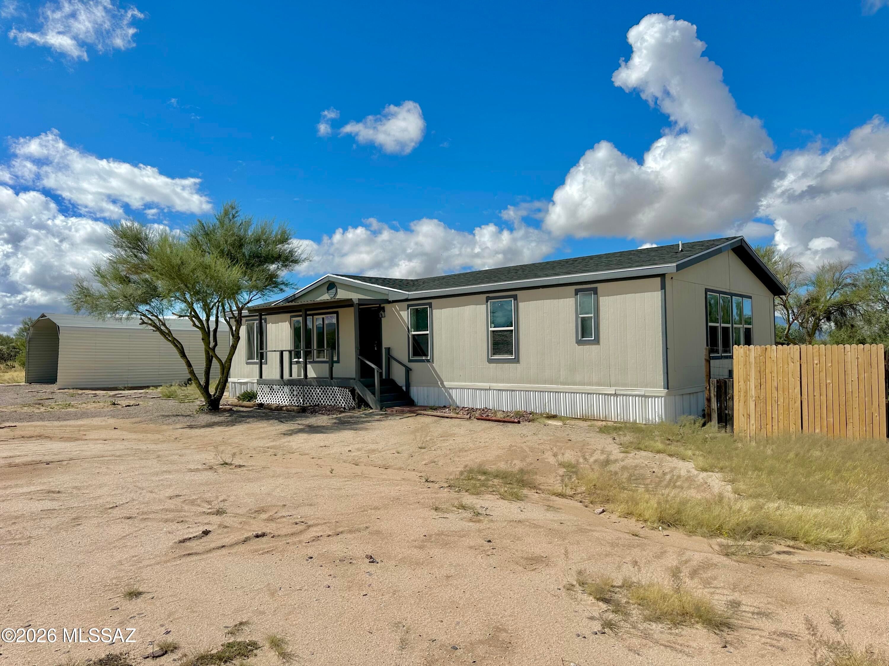 4 Bedroom 2 Bath Manufactured Home on an Acre. Spacious Open Floorplan welcomes you with lots of natural light. LVP floors throughout, no carpet here! New Roof, and Fenced Backyard for privacy and security. Who am I kidding, the property itself is ''private'' with an escape the city vibe. Large 20'x30' Parking/Shade structure with Gravel ready for your use.
This is a neat place! Don't miss the chance to call it Home.