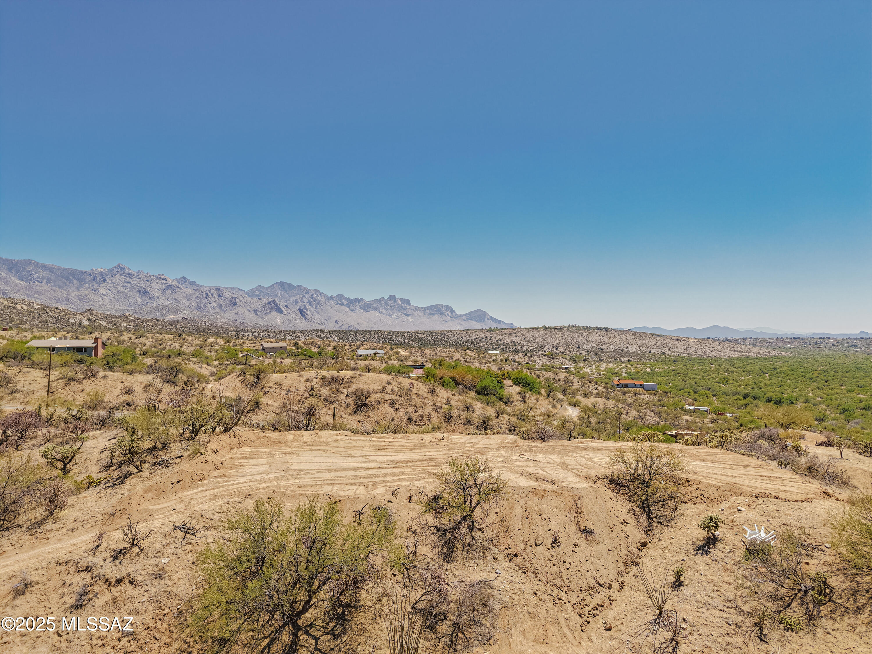 Some of the most SENSATIONAL 360 degree, top of the world views that you'll find anywhere! This 1.25 acre lot is ideal for those desiring a premium hilltop location. Imagine being able to enjoy stellar views in every direction from your home that encompasses multiple mountain ranges, city lights, and Arizona's gorgeous sunsets. Visit in the late afternoon to truly enjoy the magical ''golden hour'' light and sunset vistas. A flat area near the building site has been created so you can envision the possibilities, but even more space could be added for a future home with a little dirt work. The flexible TR zoning allows for a huge variety of potential uses too. Electric and water are available nearby and an expanded easement leads to the property from the east side, along the northern edge.