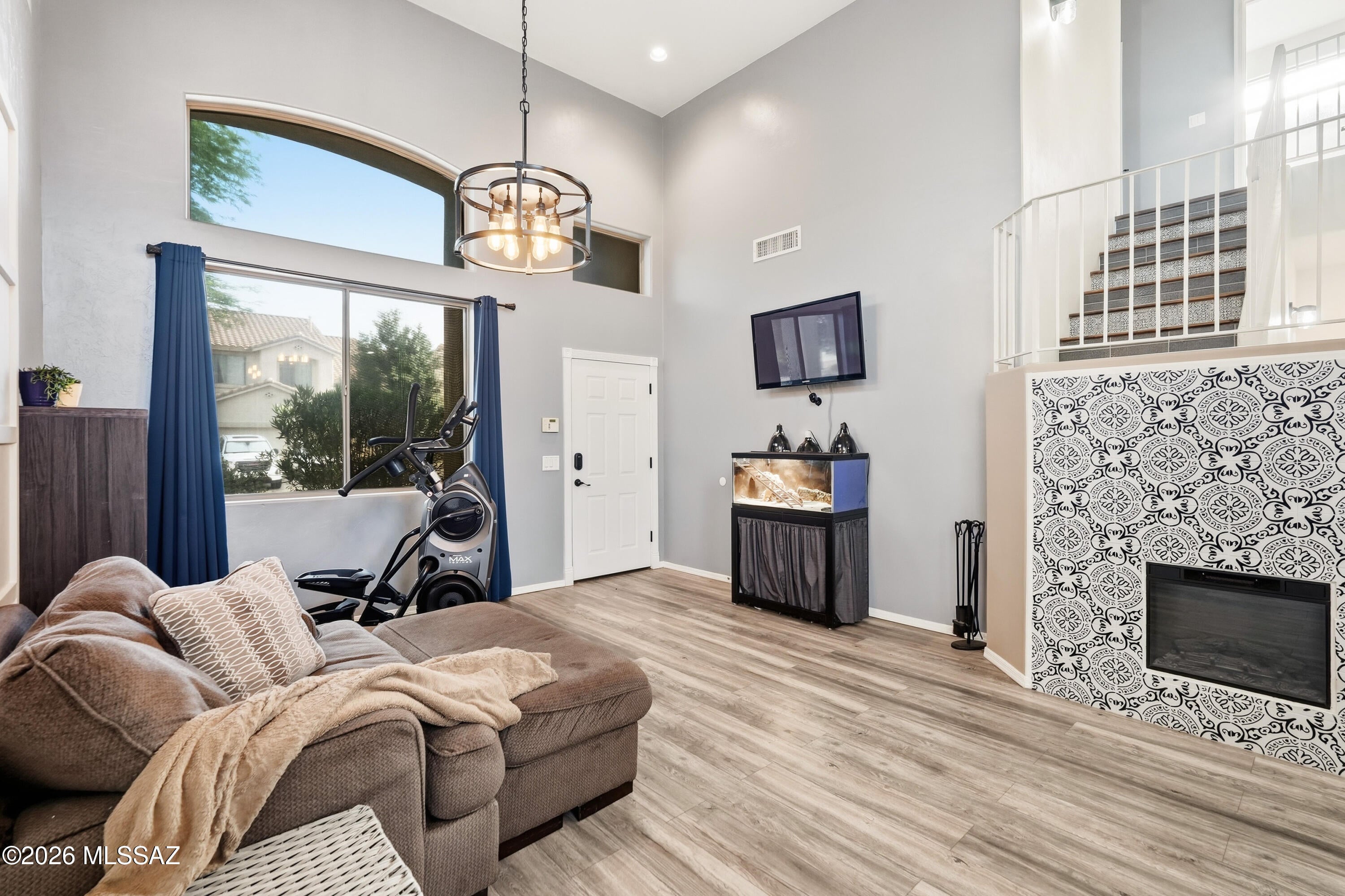 Updated, inviting, and full of flexible living space, this Rancho Sahuarita home offers a layout that feels both comfortable and unique. Step inside to a dramatic two-story entry with a spacious living room, room for a formal dining area, and additional flex space accented by a cozy modern fireplace that adds warmth, style, and character.
The updated kitchen opens to a generous family room, creating an easy everyday gathering space with plenty of room to spread out. A beautifully updated half bath and convenient main-floor laundry room complete the first level.
Upstairs, the designer staircase leads to a versatile loft that works perfectly as a home office, playroom, homework area, or second living space. The primary suite features a double-door entrance along with a special bonus room just off the bedroom--ideal for a quiet reading nook, workout space, nursery, or simply a peaceful place to unwind at the end of the day or start your morning. Two additional bedrooms and a full bathroom complete the upstairs.
Thoughtful updates throughout make this home truly move-in ready, while a new A/C unit provides added peace of mind. Exterior solar screens help with Arizona heat and sun exposure, and mature landscaping gives the property an established feel that can be hard to find with nearby new construction.
Located in Rancho Sahuarita with access to community pools, parks, trails, recreation facilities, shopping, schools, and convenient I-19 access, this home is a great option for buyers looking for more character, flexible space, and completed updates without starting from scratch.