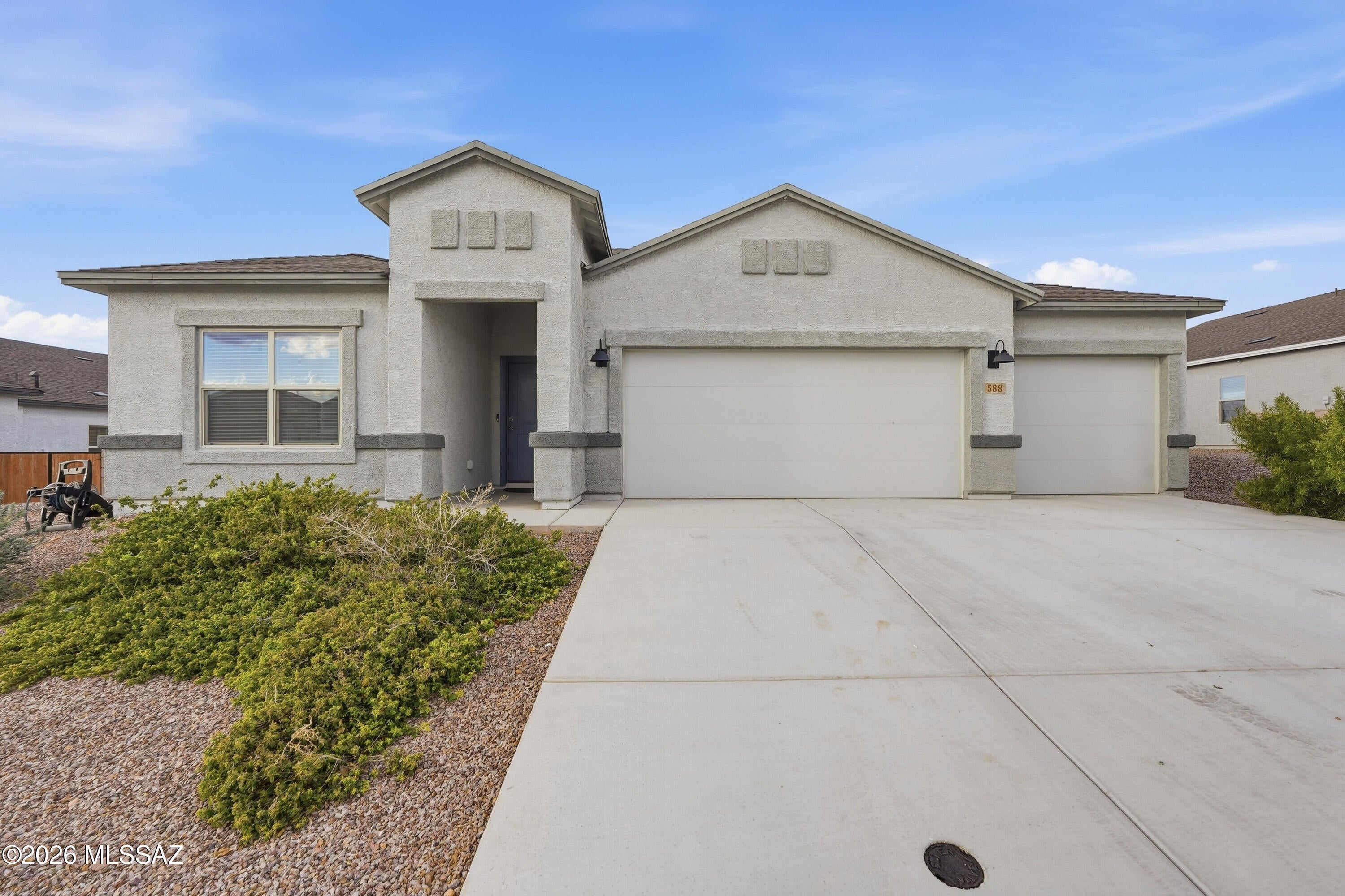 Welcome to this unique Lakeway floor plan offering plenty of space, with 5 bedrooms, 3 full bathrooms and a spacious 3-car garage. The freshly painted interior feels bright and move-in ready, with 9' ceilings, tile flooring throughout most of the main living areas, and an open-concept kitchen featuring a large island, granite countertops, white shaker cabinetry, walk-in pantry, stainless steel Whirlpool appliances, gas range, microwave and dishwasher. The dining area is enhanced with attractive built-in features, adding both style and functionality.
Additional upgrades include a tankless water heater, soft-water loop with drain, and a finished garage with epoxy flooring and a mini-split system for temperature-controlled comfort--perfect for a workshop, gym or additional usable space. The backyard offers a clean slate ready for your personal touch, whether you envision a pool, outdoor kitchen, garden, play area or low-maintenance desert retreat.

The home also includes an impressive smart-home technology package with a video doorbell, Alarm.com app, Honeywell T6 Pro Z-Wave thermostat, Amazon Echo Pop, Kwikset HomeConnect keypad lock, Deako smart switches, Wi-Fi garage door opener and smart panel.

With its flexible 5-bedroom layout, modern finishes, fresh interior paint and thoughtful upgrades already in place, this move-in-ready home offers the benefits of newer construction without the wait.
