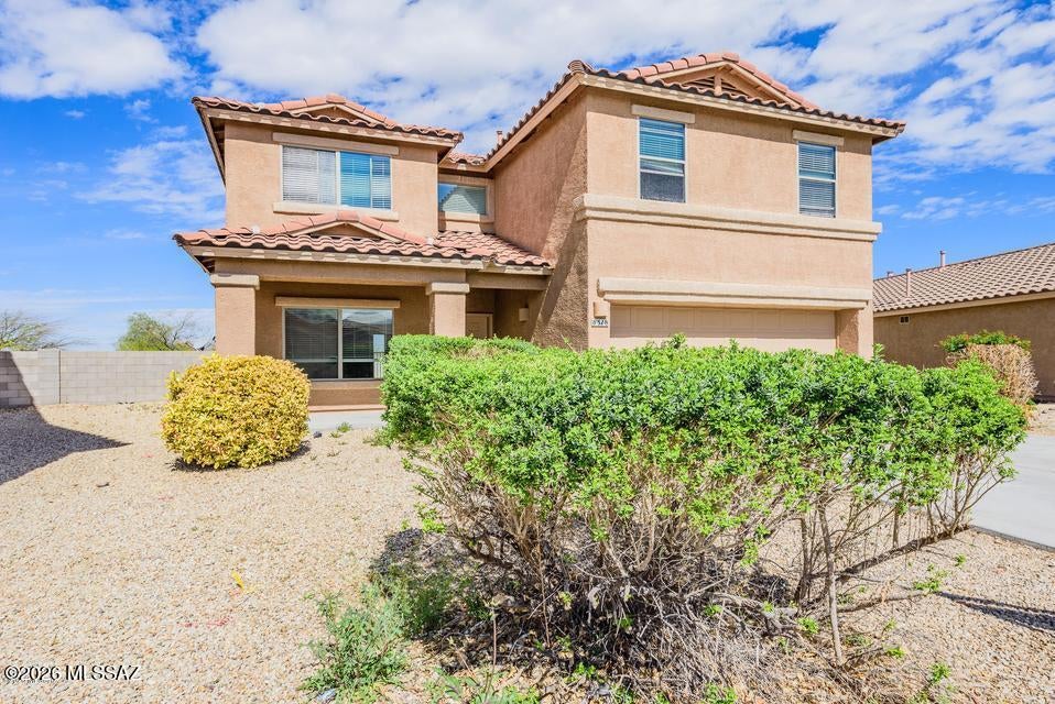 MOVE IN READY home in Empire Heights with amazing mountain views plus OVER SIZE LOT! This 4 bedrooms with office and 2.5 bathrooms. Bright and open floorplan  features Tile and Laminate floors, Granite counter tops in kitchen with stainless steel sink and faucet. The Award-Winning Vail School District. Short walk to community park, swimming pool, playground & dog park. Easy access to I-10, shopping and much more!