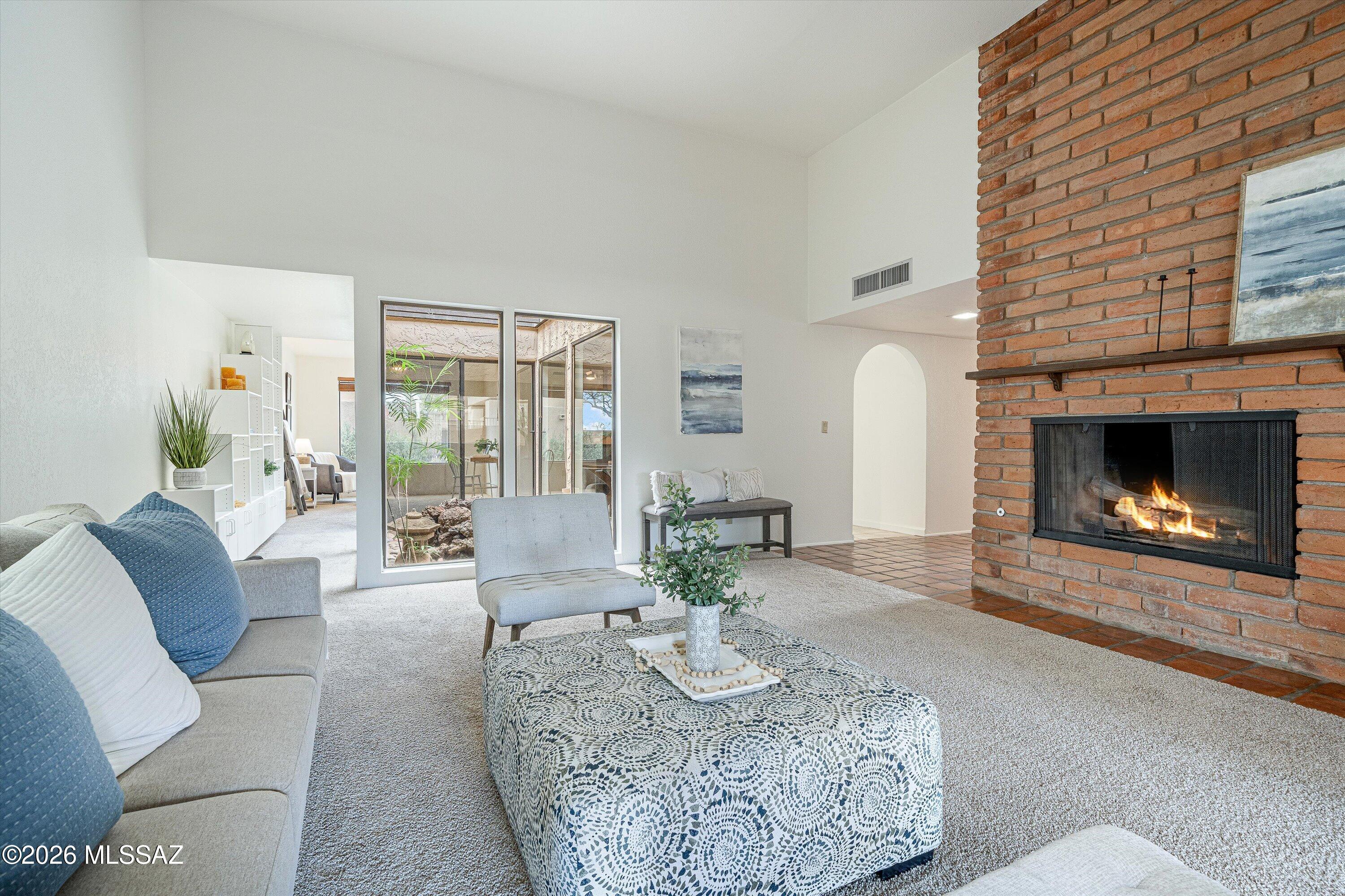 When smaller feels better...
Tucked away in an intimate Catalina Foothills community of just 40 architect-designed townhomes by renowned Tucson architect Joe Campisano, this inviting home proves that living well isn't about having more--it's about having exactly what you need.
The flexible floor plan includes two bedrooms, two bathrooms, plus a bonus den, office space, or whatever you imagine. 
A private interior courtyard with a soothing water feature fills the home with natural light and creates a seamless connection between indoor and outdoor living. The updated kitchen opens to the living spaces, while the spacious covered patio and private rooftop deck offer two unique places to relax and enjoy Tucson's beautiful weather. Fresh interior paint, new carpet, and the ease of single-level living with no interior steps make this home truly move-in ready. 
Just steps from your door, enjoy the community pool, spa, ramada, and grilling area--without any of the maintenance. The HOA covers landscaping, water, trash, road maintenance, common areas, and exterior painting, making life refreshingly simple.
Convenience is an understatement. Premier shopping, restaurants, everyday essentials, and Catalina Foothills schools are just minutes away, with a school bus stop right outside the community.
A little simpler. A little quieter. A whole lot easier.