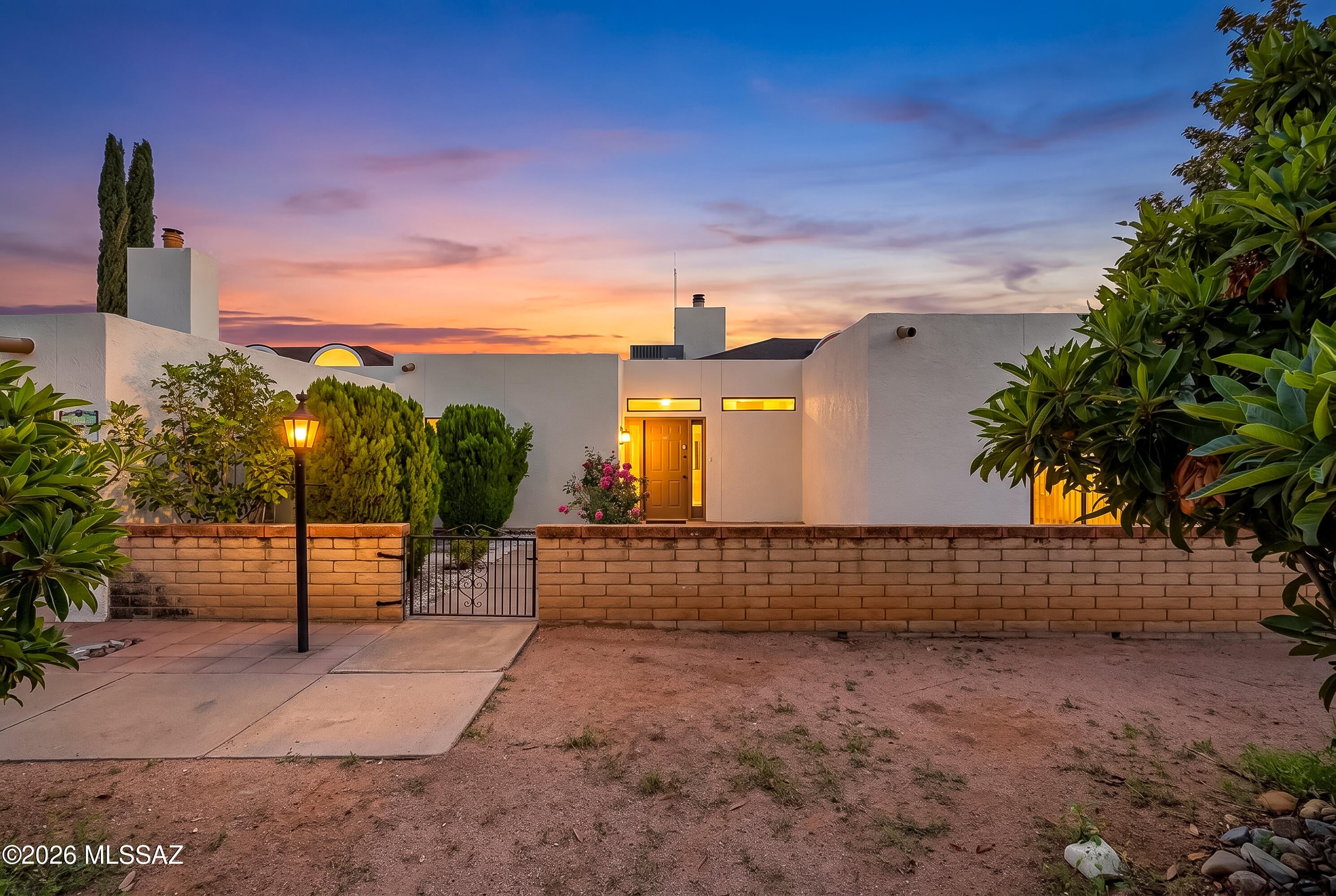 NEW ROOF! Welcome to this inviting townhome offering comfort, convenience, and beautiful surroundings! Featuring a NEW ROOF and fresh paint, this home is move-in ready and located within a desirable gated community. Step inside to a spacious great room highlighted by a cozy fireplace, perfect for relaxing. A versatile Arizona room provides additional space for a home office, sitting area, or hobby room. The thoughtfully designed split-bedroom floor plan offers added privacy, while the primary suite features a walk-in closet and private ensuite bathroom. Enjoy community amenities including a swimming pool, clubhouse, and basketball court. Conveniently located near schools, supermarkets, restaurants, and everyday necessities, this townhome combines easy living with picturesque mountain views