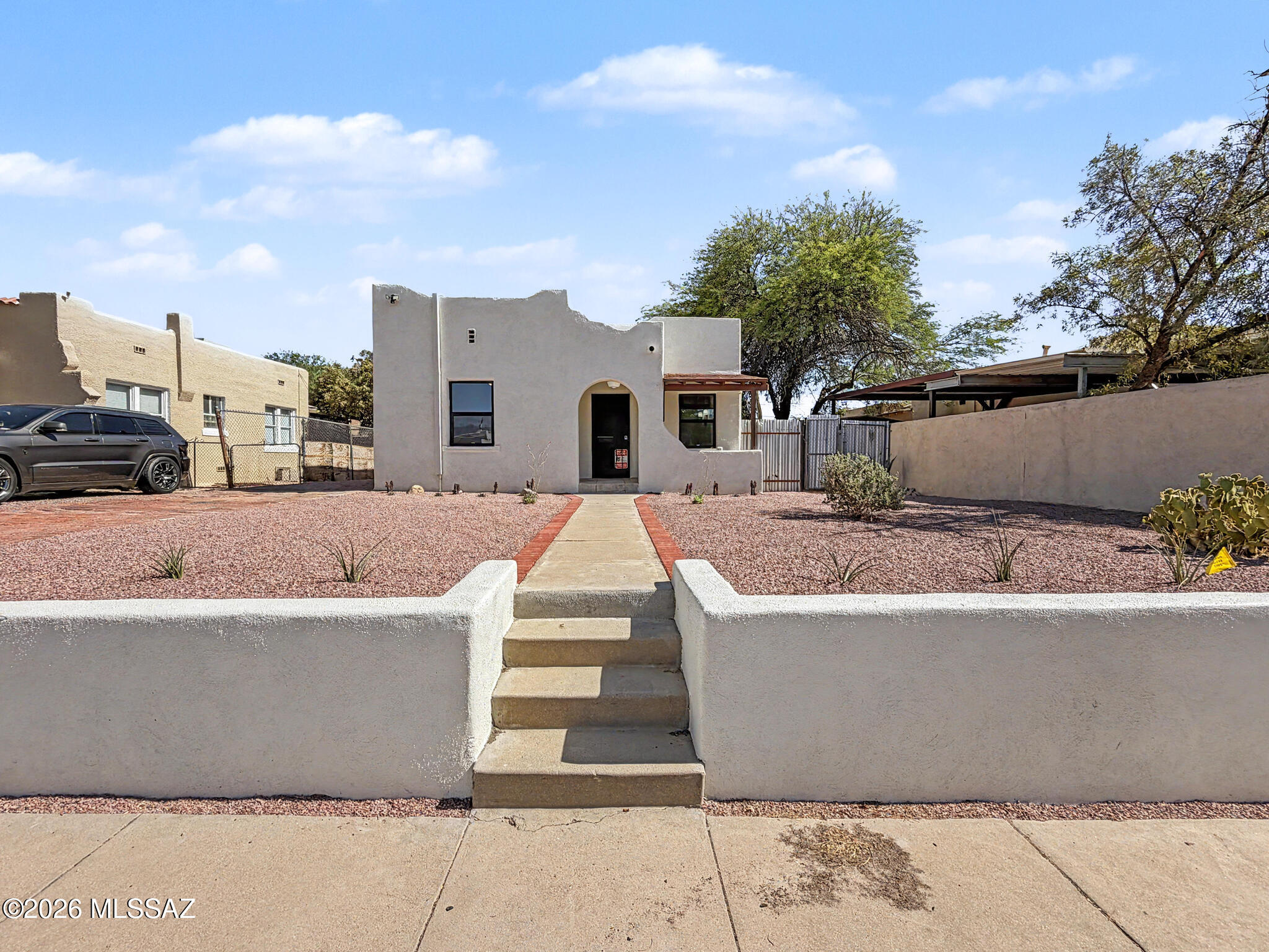 Charming 1930s home with vintage character, beautifully remodeled interiors, and 2 additional income-producing units--all within walking distance of the University of Arizona! The remodeled 2BR/1BA main home features wood-look flooring, new kitchen with stainless appliances, remodeled bath, private laundry, large front yard, driveway, covered patio and fenced side yard. An attached 1BR/1BA offers a private entrance, updated kitchenette, remodeled bath and laundry. A detached studio features a covered porch, kitchenette, spacious bath, closet and laundry. All 3 units have mini-split heating/cooling and private entrances. Ideal for an owner occupant, multi-generational living or investment! Remodeled 1930s Home with Two Income Units Near the University of Arizona

Charming 1930s home with original vintage character, beautifully remodeled interiors, and two additional income-producing units--all within walking distance of the University of Arizona campus! This unique multi-unit property offers three separate living spaces, making it an excellent opportunity for an owner occupant looking to offset their mortgage with rental income, a multi-generational household, or an investor.
Each living space has its own private entrance, mini-split heating and cooling, updated kitchen or kitchenette, fully remodeled bathroom, new appliances, and private stackable washer and dryer.
The main home features two bedrooms and one bath with a beautifully remodeled interior that blends modern updates with its original 1930s charm and character. Features include wood-look vinyl plank flooring, an updated kitchen with new cabinetry and stainless steel appliances, a fully remodeled bathroom, mini-split heating and cooling, and a private stackable washer and dryer. Outside, the main home offers a large front yard, private driveway, covered front patio, and a small fenced side yard.
Attached to the rear of the main home is a separate one-bedroom, one-bath unit with its own private entrance. This remodeled space features tile flooring throughout, an updated kitchenette with new cabinetry, refrigerator and sink, fully remodeled ensuite bathroom, mini-split heating and cooling, and its own stackable washer and dryer.
A detached studio completes the property with its own private entrance and small covered front porch. The studio features an updated kitchenette with refrigerator, sink and electric cooktop, a spacious fully remodeled bathroom, closet, mini-split heating and cooling, and its own stackable washer and dryer.
With three distinct living spaces and two existing income units, this property offers exceptional flexibility and income potential in a highly desirable location. Conveniently located within walking distance of the University of Arizona and close to downtown Tucson, shopping, dining, and entertainment.
The main house is currently vacant and available for touring. Please contact Veronica at 520-312-5516 with questions or to schedule a showing. The attached one-bedroom unit and detached studio are currently tenant occupied on month-to-month leases. 360° Zillow tours are available for both occupied units, and in-person access to these units will be provided with an accepted offer. Please do not disturb the tenants.
All three units currently share utilities and Wi-Fi; there are no separately metered utilities.