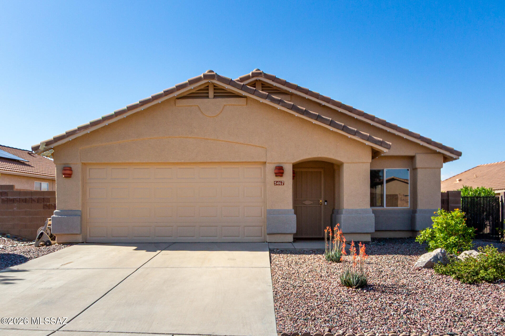 Located in sought-after Dove Mountain, this 3 bed/2 bath (1581 sq ft) home sits on an elevated lot that allows for mountain views. Enjoy the benefits of brand new home insulation (summer '25) and a newer HVAC system ('22). Recent cosmetic upgrades include exterior paint, interior paint of common areas and bedroom ceiling fans. The floor plan offers two living spaces with vaulted ceilings- a private family room with a fireplace and an open concept front room for entertaining and dining. Kitchen highlights include new SS stove, fridge, and garbage disposal, pantry, breakfast bar, and beverage counter. Outside, you'll find beautiful vegetation, turf grass and pavers, as well as, a covered patio with epoxy coating. Close proximity to stores, restaurants, schools, hiking, golf clubs, and parks.