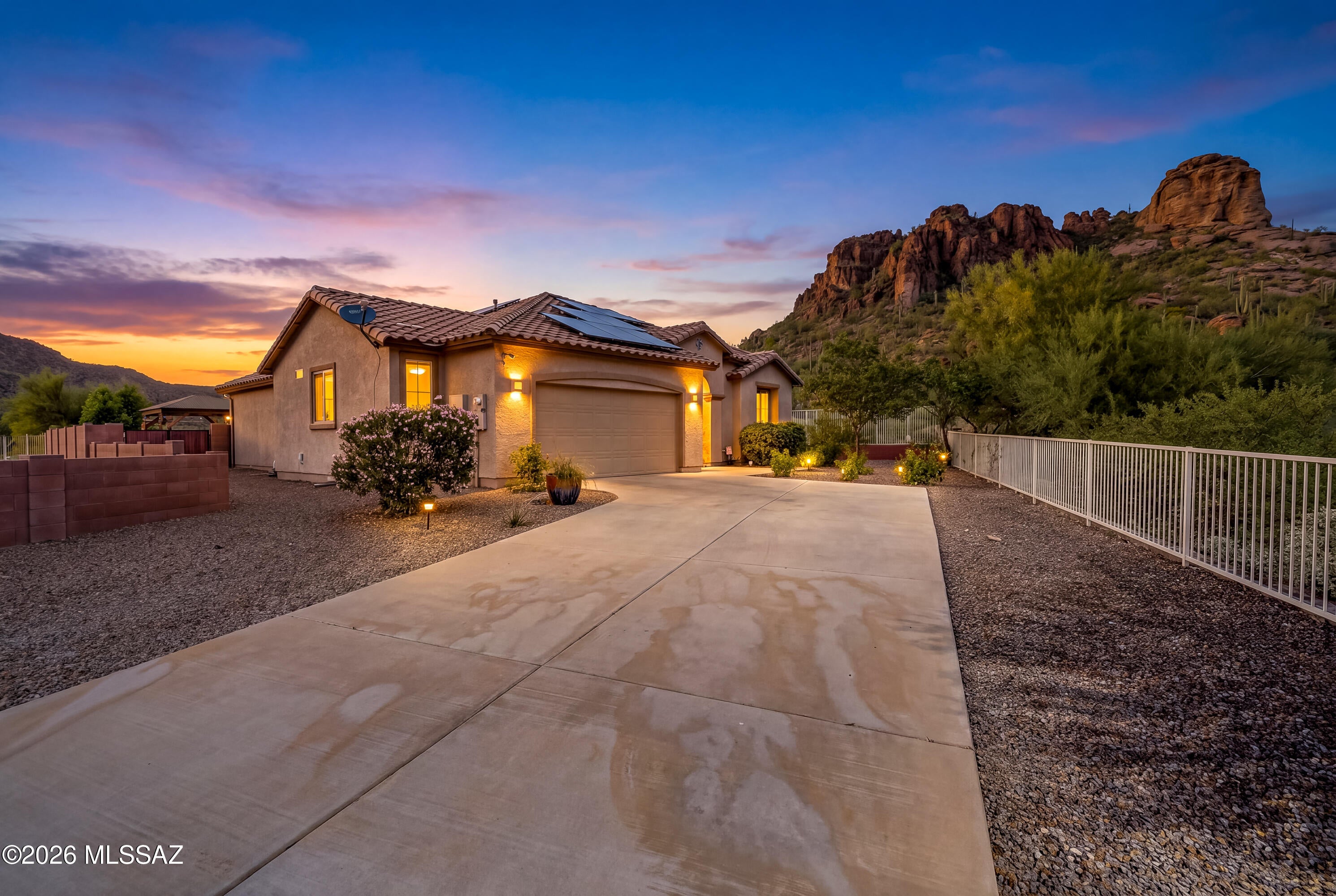 The ideal lot location within Westpoint View! Sited on an elevated corner lot at the end of the street with no neighbors behind and fantastic mountain and desert views! A long driveway adds to this private lot, while the open-concept design, high ceilings, and split-bedroom floor plan create a spacious, comfortable feel. Updated kitchen features stainless appliances including gas range, and large walk-in pantry. Huge primary suite with generous sized walk in closet. Freshly painted interiors, newer window coverings, updated powder bath. Owned solar system offers added energy efficiency, and oversized two car garage provides plenty of room for parking and storage. Spacious, low-maintenance backyard complete with ramada, lovely pavers & desert plantings. Convenient southwest side location!