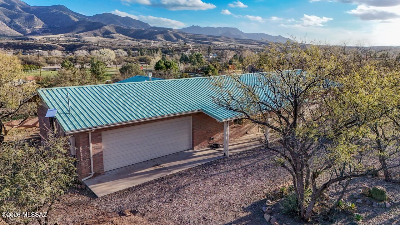 This beautiful, completely renovated brick home is ready to become your forever sanctuary. Nestled on a spacious 0.89-acre lot, it delivers complete tranquility and total privacy thanks to mature mesquite trees that shield you from the outside world. Enjoy unobstructed panoramic views of iconic Red Mountain right from your windows.Inside, modern updates create a fresh, welcoming space ideal for relaxed living or entertaining. The attached 2-car garage adds convenience and storage.Step out to the inviting back porch--great for entertaining friends, family gatherings, or simply enjoying life's peaceful moments surrounded by nature. A truly unique property that feels like a serene retreat yet offers easy access to everyday needs. If you're seeking quiet beauty and character, this is it!