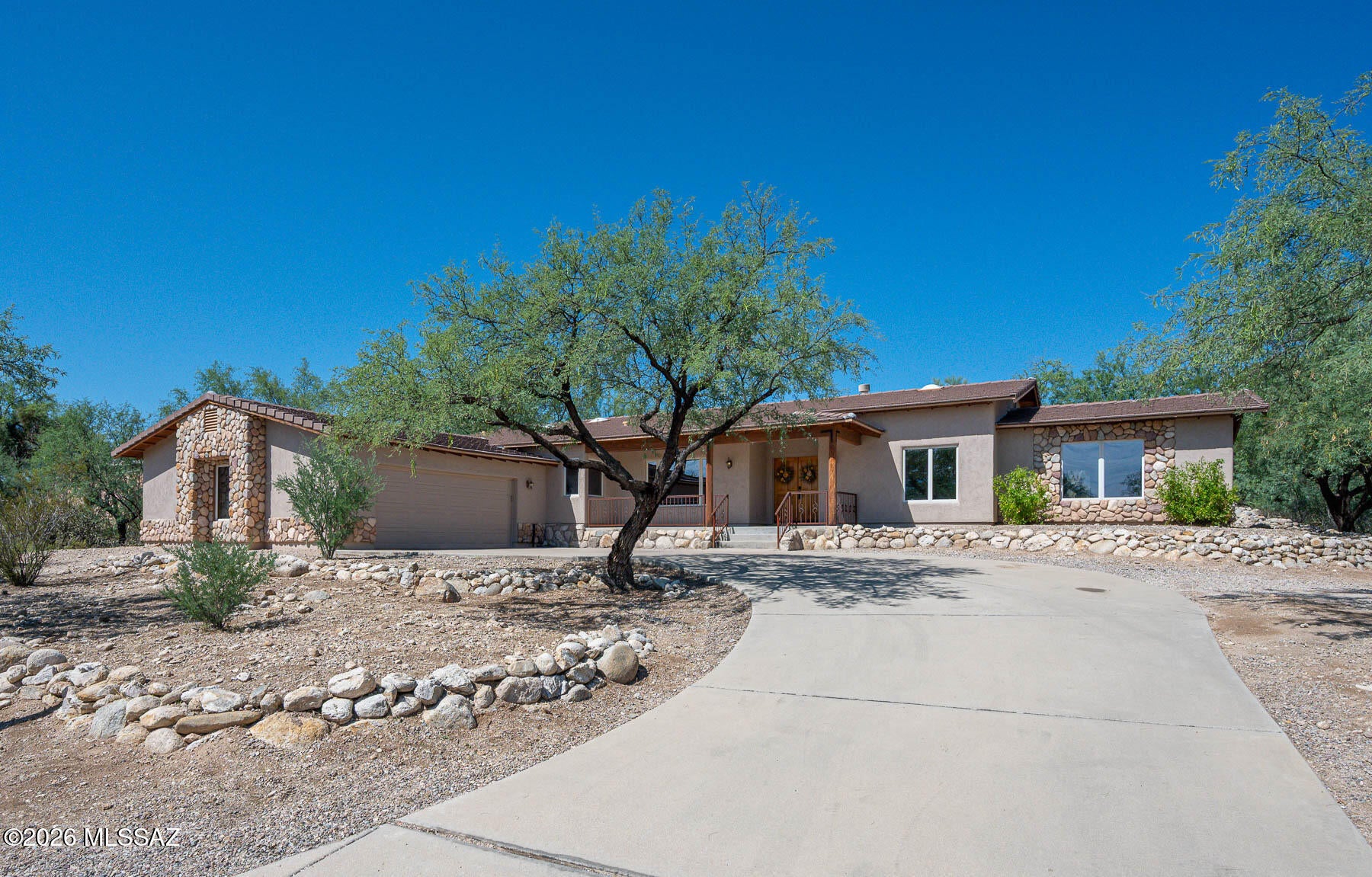 Beautiful home located close to the Sabino Creek. Views of the Catalinas from the front porch.  Freshly painted inside and out, in soft neutral tones, ready for your personal style.   Gas cook top with 5 burners, double oven and island in the kitchen.   Large main bedroom with adjoining bathroom.   Bedrooms 2 and 3 share a jack and jill bathroom with double vanities.  The 4th bedroom is next to it's own bathroom.  Large terraced backyard, to add the flowers of your personal choice.  This gem of a house is is on a quiet no outlet street.  Right next t o Sabino Creek, there are birds and wildlife to be seen very often.