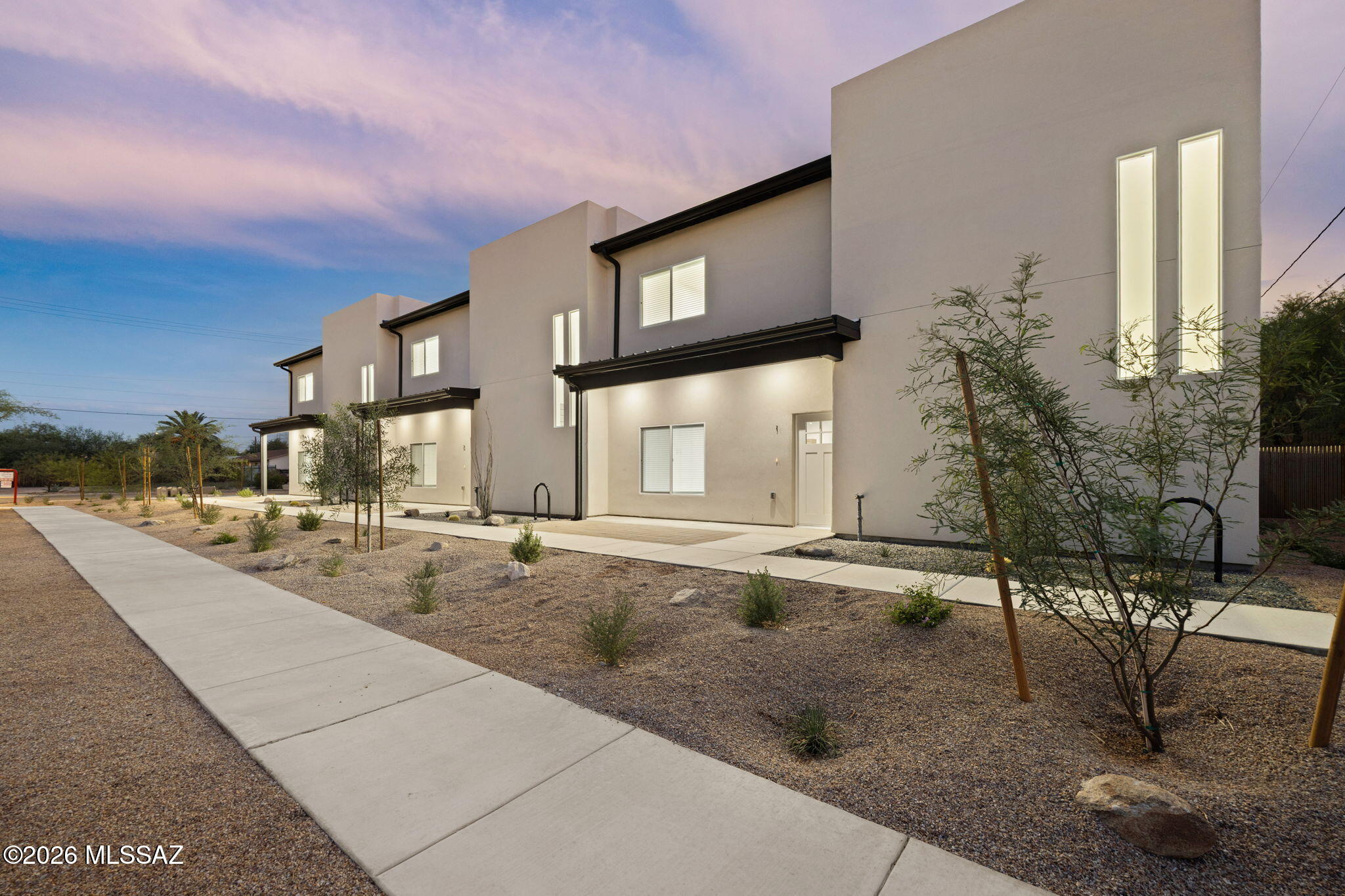 Exceptional brand-new construction student housing just blocks from the University of Arizona and minutes from Downtown Tucson! Purpose-built with 3 bedrooms and 4 bathrooms, this thoughtfully designed property features three spacious en-suite units, including ADA-accessible lower-level accommodations. High-end finishes, modern kitchens and baths, and quality craftsmanship create a premium living experience designed for today's student renter. Generous asphalt parking, dedicated bike parking, and additional off-street parking add convenience. A rare opportunity to acquire turnkey new construction, modern, upscale housing.
