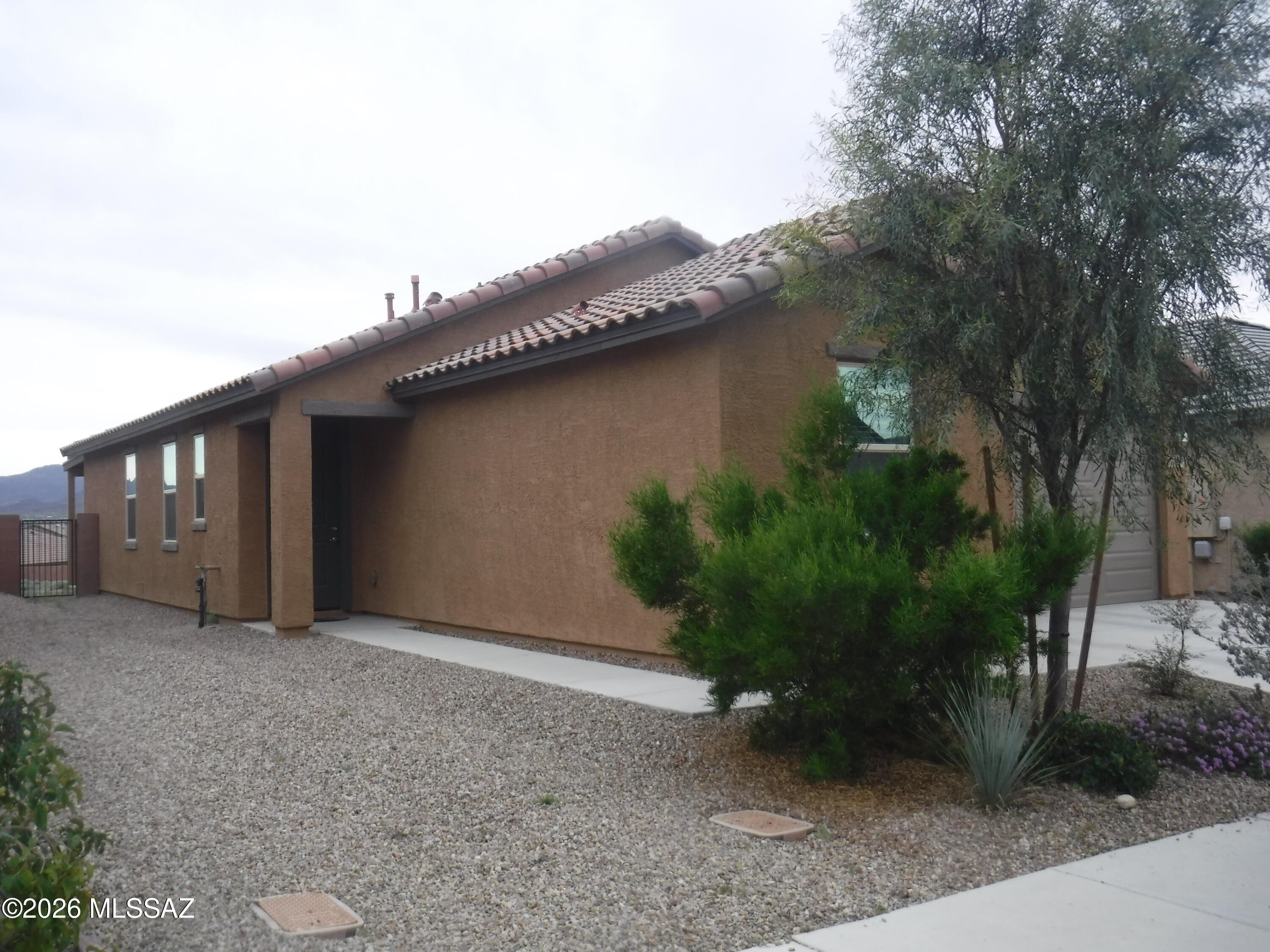 Beautifully designed 3-bedroom, 2-bath home offers modern comfort and style. The open kitchen features a spacious island with a breakfast bar, perfect for casual dining and entertaining. A thoughtfully planned split floor plan provides privacy in the primary suite, complete with its own bath. Step outside to a landscaped backyard where you can relax and enjoy the elevated lot, offering extra privacy and views. Move-in ready and well maintained, this home combines function and charm--don't miss your chance to lease here!