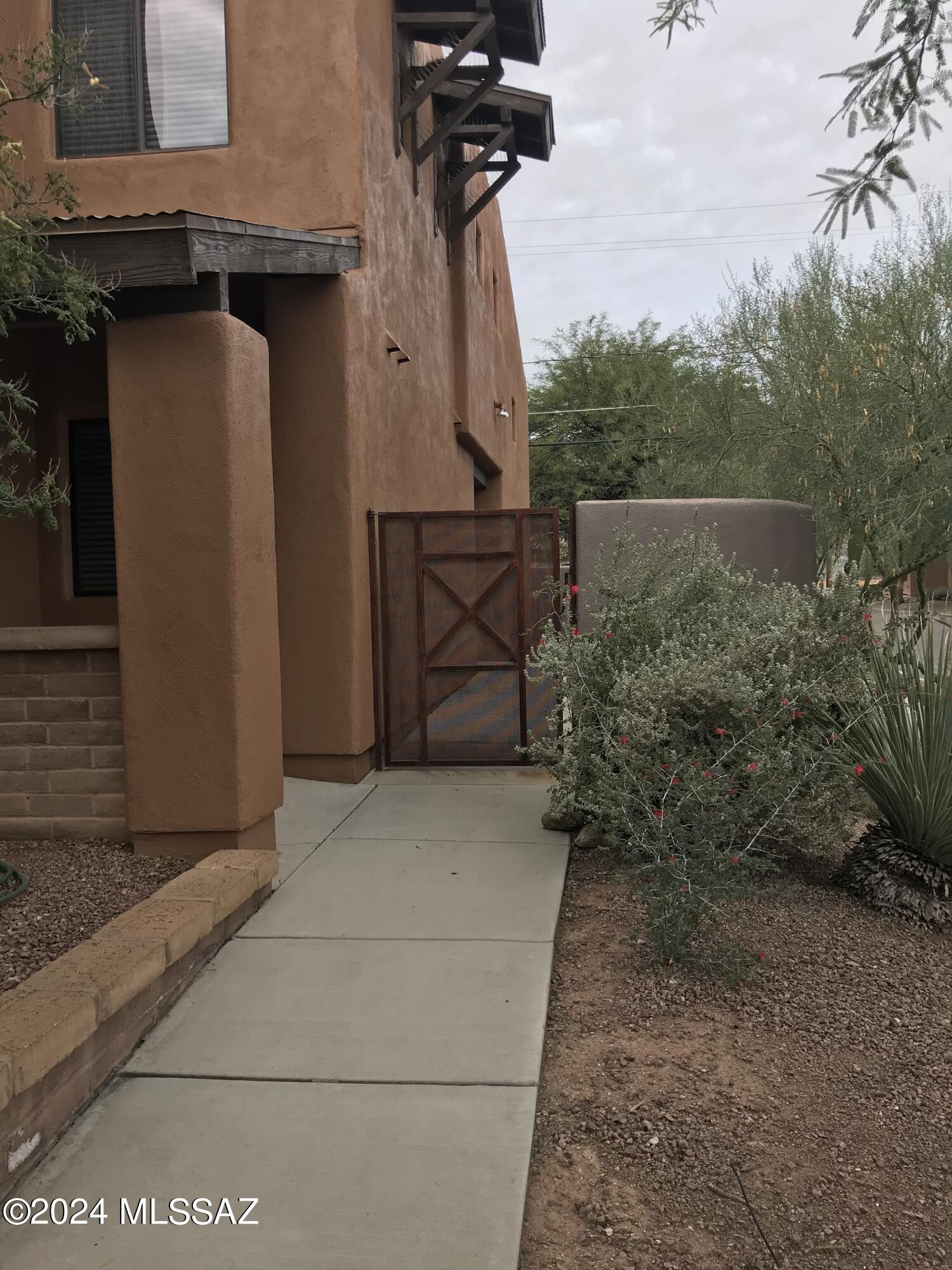 Welcome to this charming two-story, 3-bedroom, 2-bathroom rental condo located in the heart of Tucson. Offering comfort, convenience, and plenty of living space, this home is ideally situated near shopping, dining, entertainment, and everyday amenities.

The main floor features easy-to-maintain tile flooring throughout, along with a spacious bedroom and full bathroom. The open-concept living and dining area is filled with natural light and includes double doors that lead to a private, fenced backyard--perfect for relaxing or entertaining.

The well-appointed kitchen offers abundant cabinet and countertop space, a large pantry, gas range, built-in microwave, dishwasher, garbage disposal, and refrigerator. A nearby laundry area includes a washer and dryer for added convenience.

Upstai Upstairs, you'll find a versatile loft area, an additional bedroom, and a spacious primary suite with a private bathroom. Large closet space, dual vanity sinks & shower and tub. Step out onto the upstairs balcony to enjoy beautiful Tucson sunrises and sunsets.

Additional features include a private garage for parking and storage, a fenced backyard, and a functional floor plan designed for comfortable everyday living.

This inviting home combines space, convenience, and charm in a desirable Tucson location