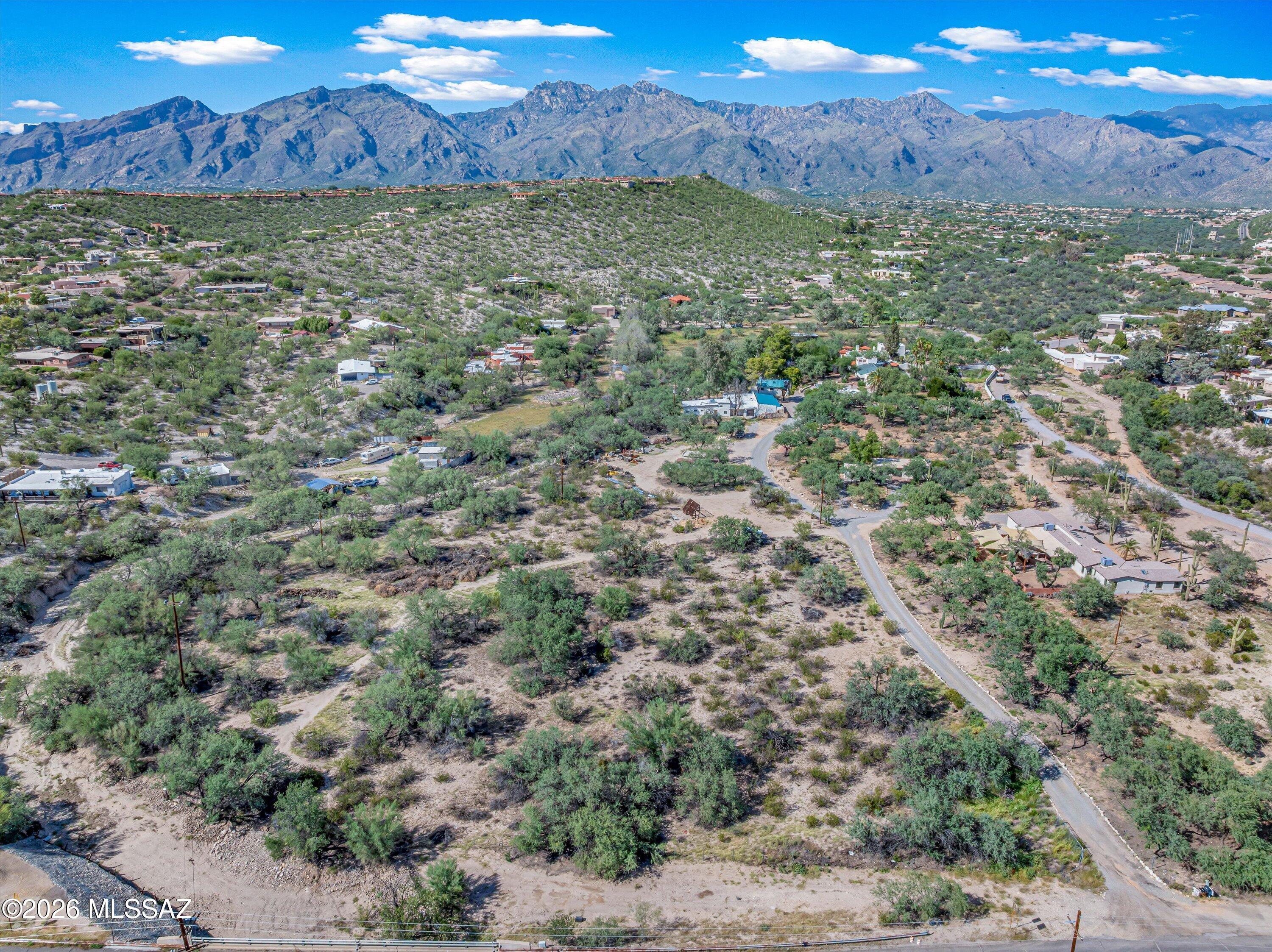 Rare opportunity to create something truly unique! This 3.31 acre parcel features a low-sloped landscape with plenty of space for a custom ranch property. Zoned SR and suitable for horses, it is located in the lower Foothills with convenient access to shopping, dining, and everyday amenities. Enjoy a peaceful desert setting, natural surroundings, and the privacy of acreage while remaining close to town. Bring your vision and create a property that fits your lifestyle. Looking for even more space? An additional 2.07 acre property with CR-1 zoning is also available directly to the west. See MLS# 22622317 for details.
