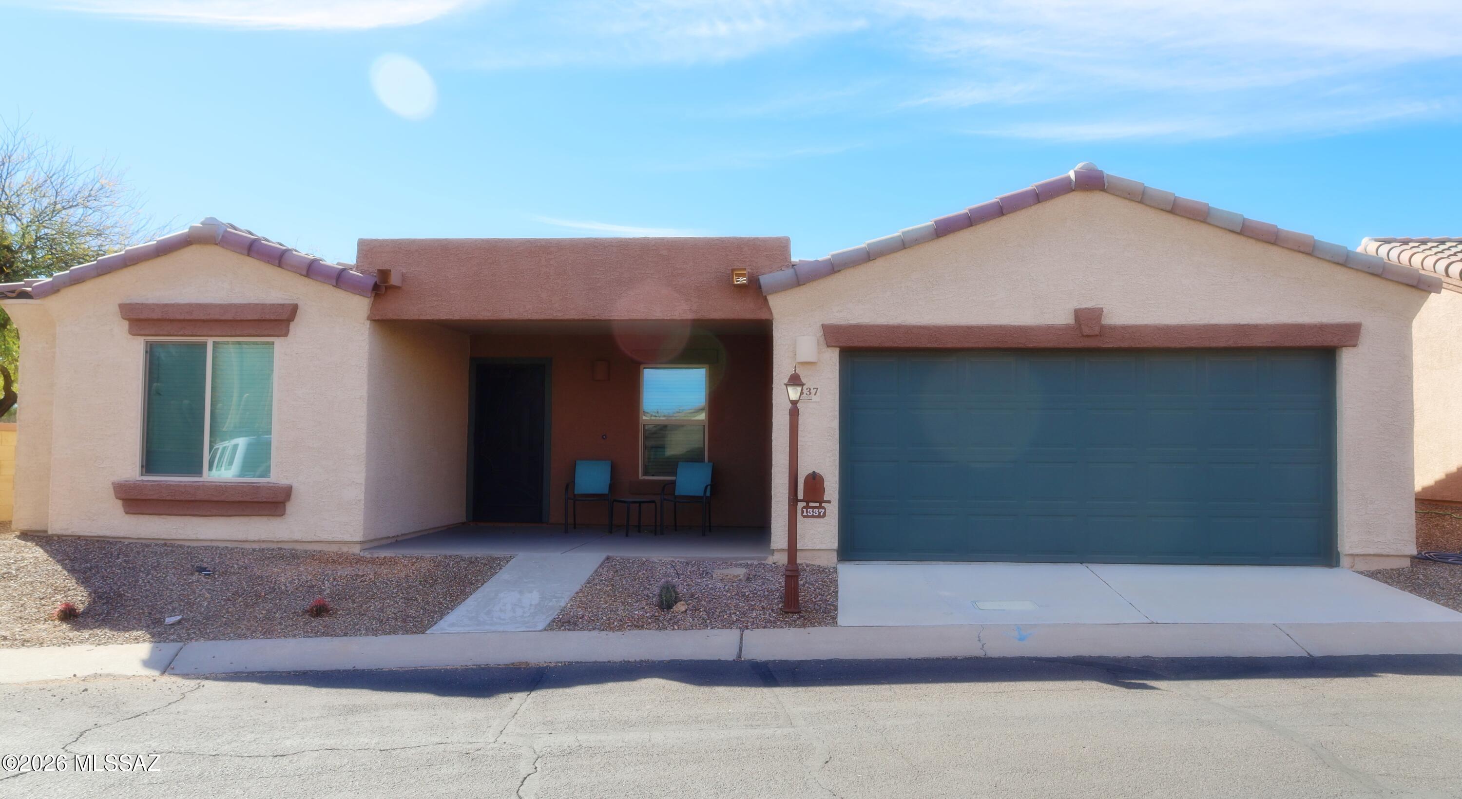 Don't miss your chance to own this gorgeous 1388 square foot home located in the gated, Active Adult Community of Rancho Resort in Sahuarita. This home boasts a split floor plan with 2 bedrooms, 2 baths, a den, plus 2-car garage. Step inside to find a modern kitchen that opens to the dining room and great room. The kitchen features granite countertops, upgraded cabinets, pantry, breakfast bar, and stainless-steel appliances including gas range, microwave, dishwasher, and refrigerator. Reverse osmosis water is available at the kitchen sink. Off the great room you find a comfy den or possible office space. Throughout the home you will find custom window treatments, upgraded light fixtures and ceiling fans. Relax on the patio or take advantage of all the amenities that Rancho Resort offers. The clubhouse and amenities including a pool, are just a short walk away. Rancho Resort also offers cycling paths, volleyball courts, pickleball courts, bocce ball, tennis courts, horseshoes, a putting green, their own "Village Green" park and more.