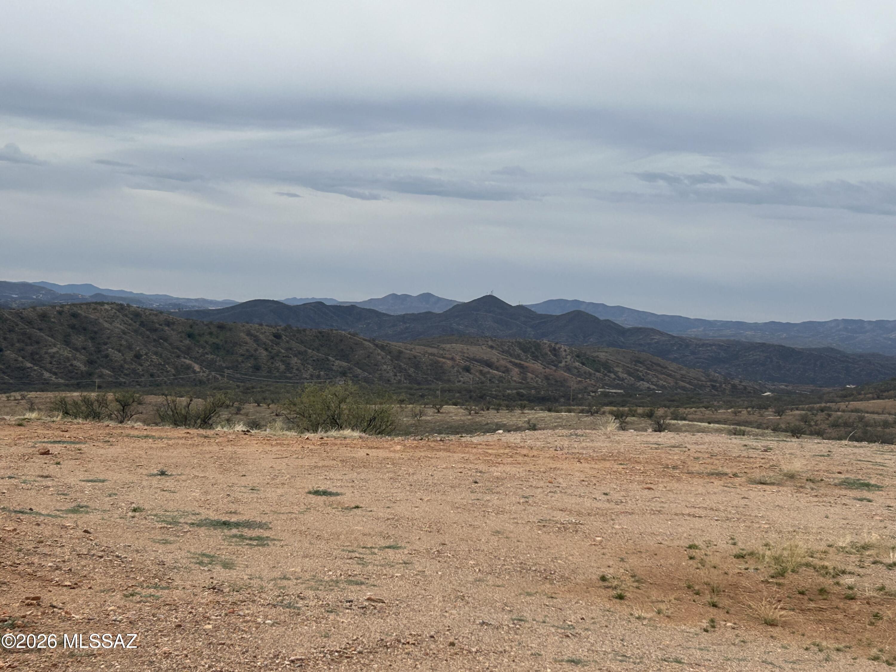 WOW!  WHAT A BARGAIN!  9.18 Acres ready to build your dream house.   Building pad is already in place with septic and leach field already installed.  Electricity is right at the lot line.  Private well to be shared with the adjacent parcel.  Well share agreement will be recorded at Close of Escrow.  Lovely sunset and mountain views and plenty of room for outbuildings, hobbies, or horses.  Conveniently located between Patagonia and Nogales with all the recreational opportunities available from nearby Patagonia Lake State Park.  Adjacent parcel is also available for only $55,000.