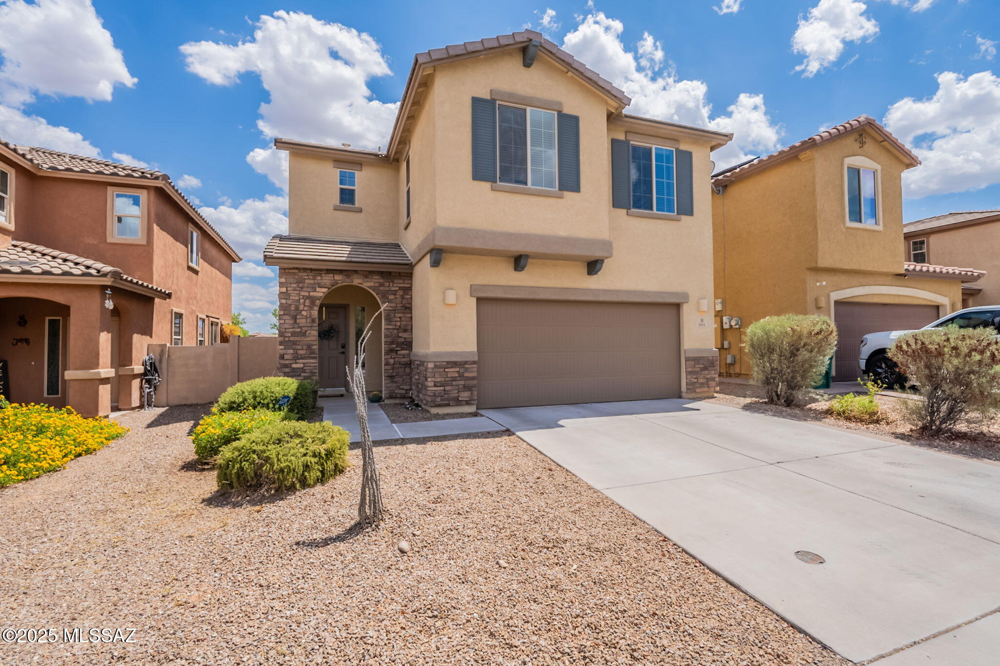 Welcome home to this 2-story gem nestled in the award-winning master-planned community of Rancho Sahuarita. Ideally situated with no direct rear neighbors and just steps from the community park and pool, this home offers both privacy and convenience. The main level and upstairs feature a stylish blend of upgraded tile and laminate flooring, while the bedrooms are fitted with brand-new carpet for added comfort. The airy floor plan welcomes plenty of natural light throughout, and the kitchen boasts granite countertops, stainless steel appliances, and rich espresso cabinetry. Upstairs, a spacious loft provides flexible living space perfect for a home office, playroom, or media room. This move-in ready home invites you to enjoy the perfect blend of comfort, style, and community.