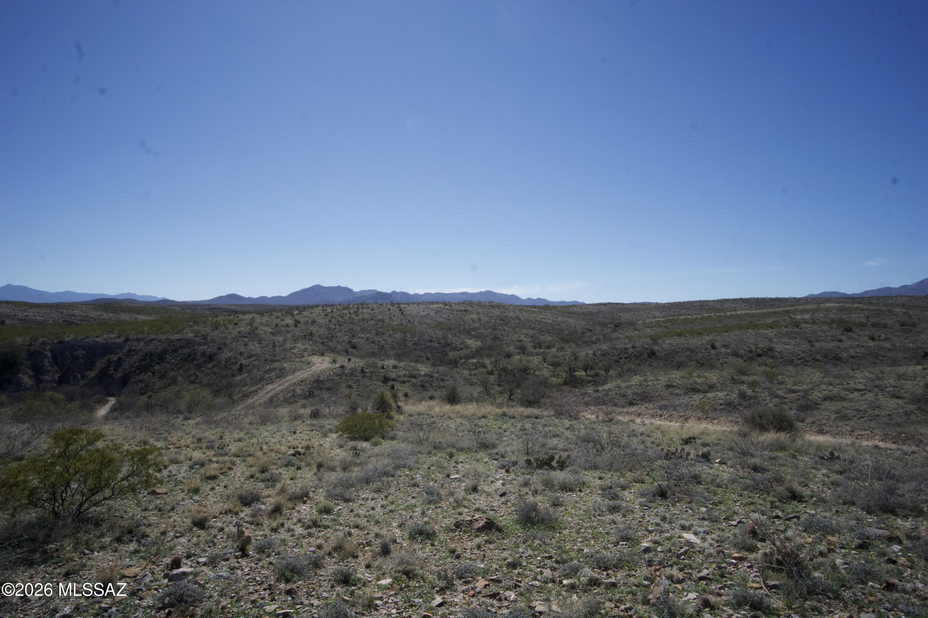 Beautiful 5.42-acre parcel bordering State Land with sweeping desert and mountain views in every direction. This gently rolling property offers multiple ideal build sites, wide-open space, and the privacy buyers are looking for. Enjoy peaceful surroundings away from traffic and congestion while still being just minutes to I-10 via paved Marsh Station Rd and convenient to Vail and Tucson amenities. Electric and phone are available at the lot. There is opportunity to improve the existing well shared with the adjacent parcel to the north. Deed Restrictions require 1,600+ sq ft site-built custom homes only; no manufactured or modular homes permitted. Staked and flagged in 2023. Sellers are licensed real estate agents in the State of Arizona (Owner/Agent).