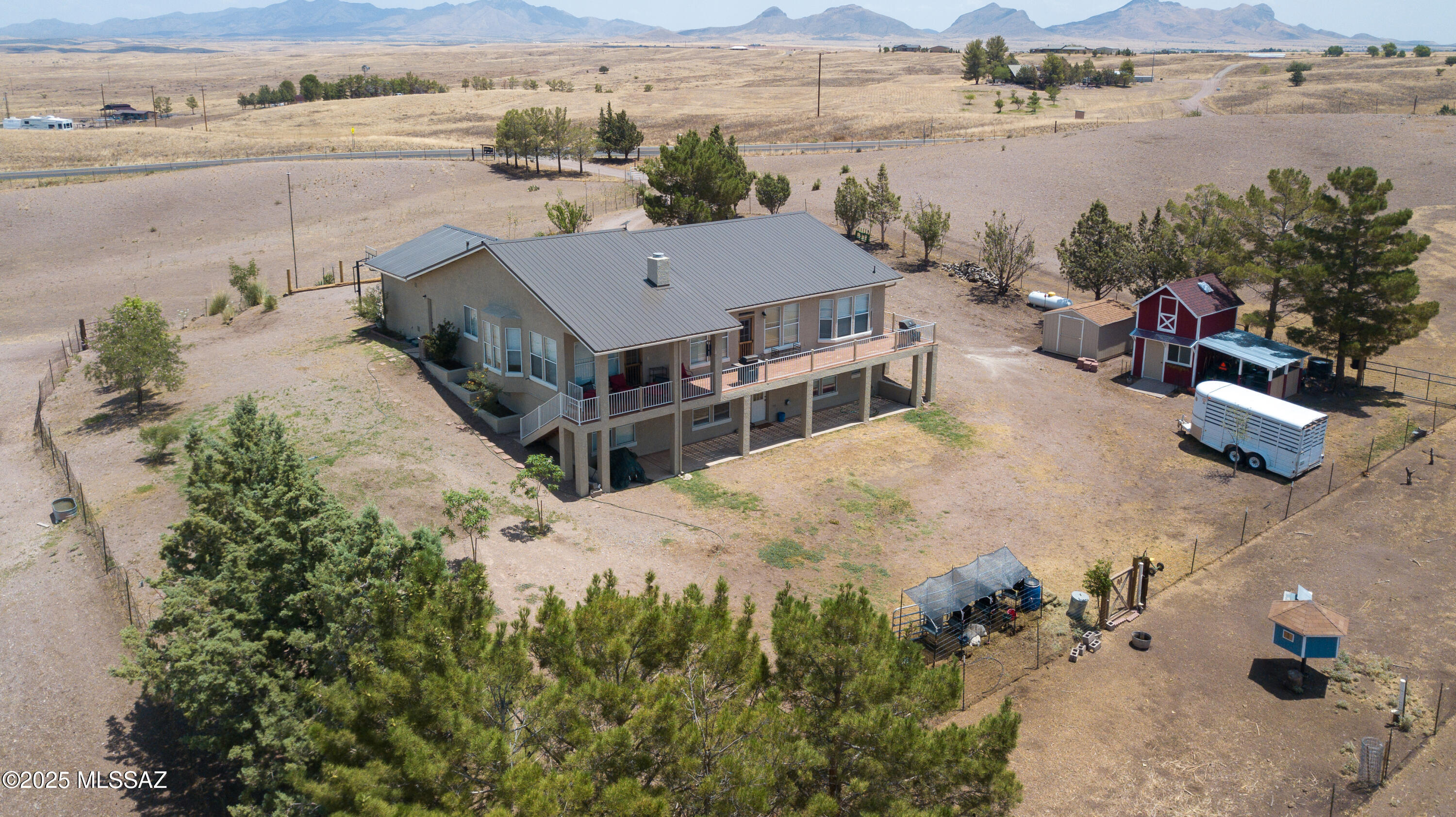 Welcome to 2804 Highway 83 in the heart of Sonoita, Arizona—an exceptional opportunity offering flexibility, space, and the peaceful lifestyle that southern Arizona is known for. This charming 4-bedroom, 3-bathroom home sits on a total of 8.18 acres, which includes the sale of the adjacent 5-acre parcel, providing ample space for horses, a hobby farm, vineyard, or future development. Spanning 2,478 sq ft, the home is thoughtfully designed for versatility with two fully functional levels. The main floor offers a spacious layout with comfortable living areas, a well-equipped kitchen, and expansive views of the surrounding grasslands and mountains. Downstairs, the lower level features a private entrance, kitchenette, and dedicated heating and cooling systems, making it ideal for multi-generational living, long-term rental income, or short-term vacation stays in Sonoita wine country.
Outside, the property is fully fenced, features a storage shed, milking barn, chicken coop, and two covered stalls, and is equipped with a private well and well house, providing you with the privacy, independence, and space to enjoy the country lifestyle truly. Just minutes from local wineries, shops, and trails, and with easy access to Highway 83, this property offers both seclusion and convenience.
Whether you're looking for a full-time residence, an investment property, or a getaway in one of Arizona's most scenic regions, this property is packed with potential. Experience the beauty, space, and freedom of life in Sonoita!