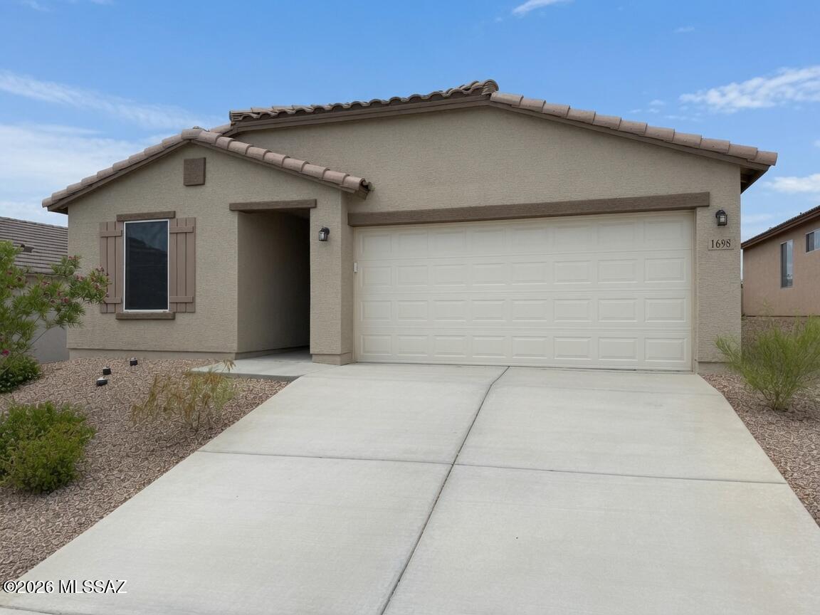 Welcome to this beautifully maintained 4-bedroom, 2-bath home built in 2024, located in the highly desirable Canyons at Whetstone Ranch community. Better than new, this home features thoughtful upgrades throughout, including whole-house UV sun screens, custom blinds, a reverse osmosis water system, and a professionally landscaped backyard ready for you to enjoy from day one.
Inside, you'll find a spacious and functional floor plan designed for modern living, while outside you'll be captivated by breathtaking 360-degree mountain views that showcase the beauty of Southern Arizona from every angle. Whether you're relaxing at home or entertaining guests, the stunning scenery provides the perfect backdrop.
Conveniently located with easy access to Tucson, Fort Huachuca, shopping, dining, and everyday amenities, this move-in ready home offers the perfect combination of comfort, convenience, and spectacular views. Don't miss your opportunity to own a nearly new home with upgrades already completed and views that truly set it apart.
