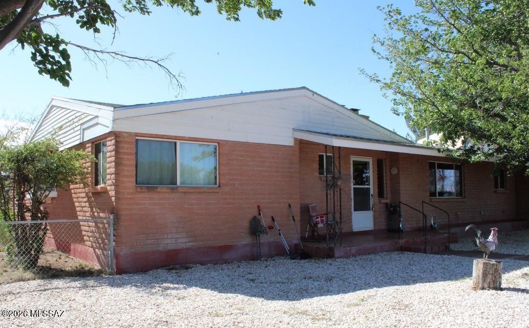 Cozy 3bdm, 2 1/2 bath home with 2 fireplaces on 10 acres. Updates in the past 2 years include roofs for the house and large shed, granite kitchen counter tops, new oven & microwave, new AC unit, updated wiring, paint & window coverings, and laminate floor in the formal LR, 1 BR & dining room. True country setting with a private well & newer septic. Indoor storage off laundry room which has a half-bath and access to the back yard which includes a brick well house large enough to provide work space or storage. Fenced back and front yards for children or pets with perimeter wire fencing. Large hall bath has double vanity and tub. Lovely garden/bay window in the middle room. Covered patio off the Family room is great for watching sunsets. Primary bedroom has private access to the back yard