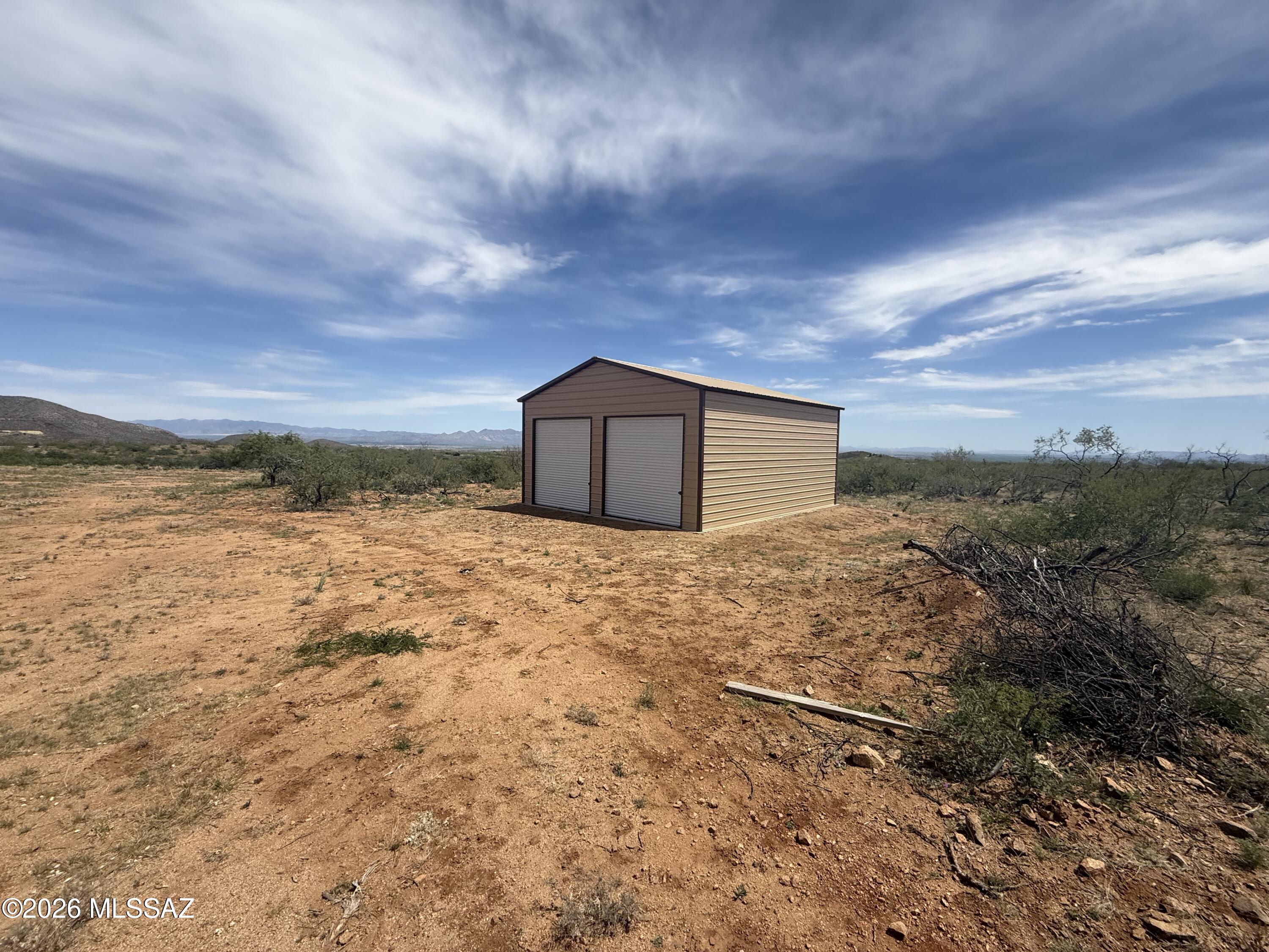 42.86 acres in High Lonesome Ranches with an amazing metal building awaits your custom home! Large view lot with amenities such as a private well and power pedestal on property. Well has been dug but no pump or electricity, power less than 100 yards away to the building and well site. This is the dream home starter kit you've been waiting for! Come bring your horses and toys to this amazing area boasting of some of Cochise county's most interesting history. Close to Historic Tombstone and Gleeson jail, this property has a lot of useable areas for a large home, horse corrals and much more. Explore the high desert just minutes from this property.