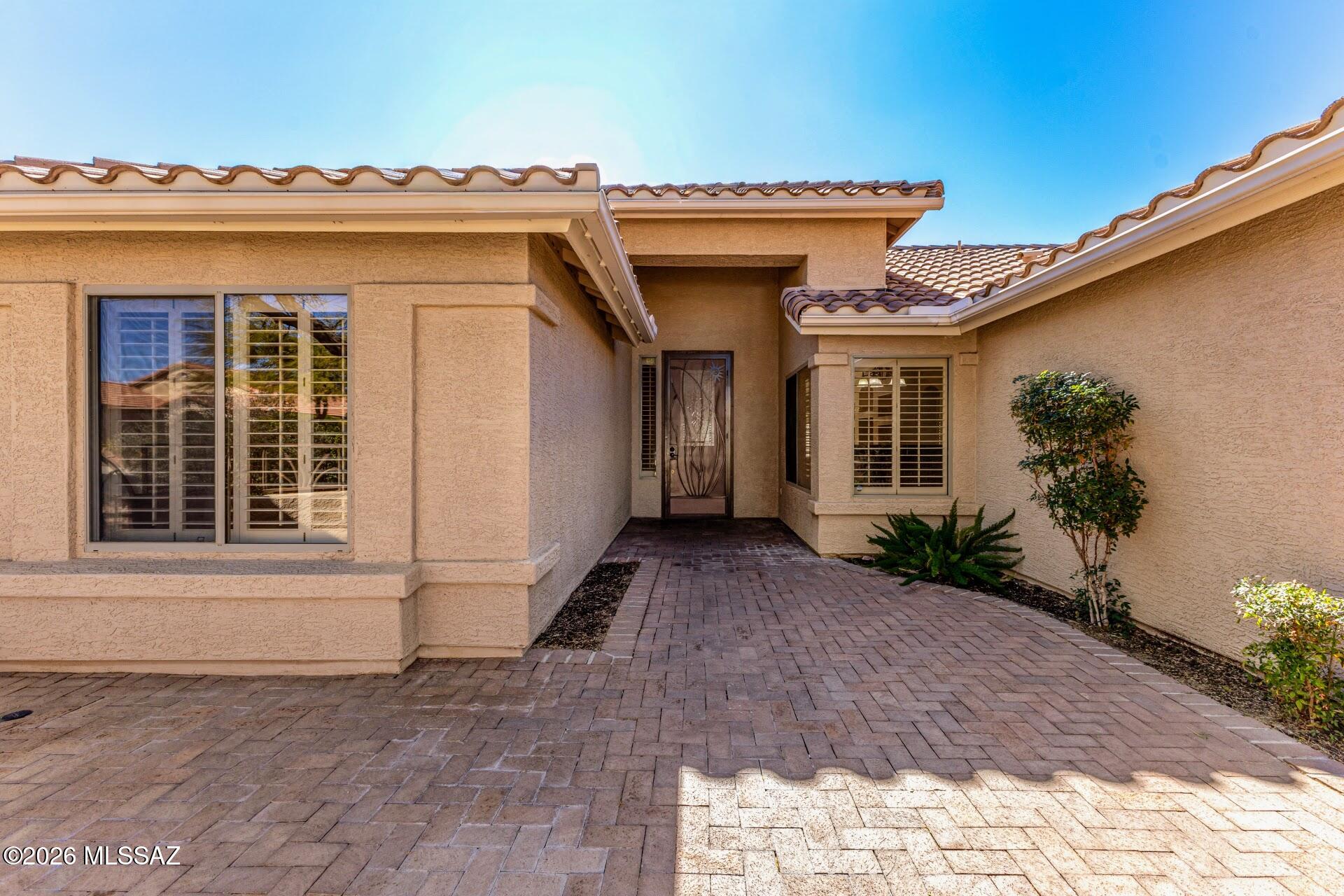 Welcome to Quail Creek, a Resort Community offering first-class amenities for an active lifestyle that is both physically and socially engaging. This home features a 1,569 sq. ft. split floor plan with two bedrooms, two bathrooms, and a den. Ceramic tile flooring and wood plantation shutters on all windows. Outside, the covered back patio and mostly enclosed yard are designed for privacy and easy maintenance, including built-in seating. The front yard is completely enclosed, providing saftey and shade for you and your fur babies. This home also has a 3 car garage that is large enough to use as a craft room, workshop or golf cart parking.