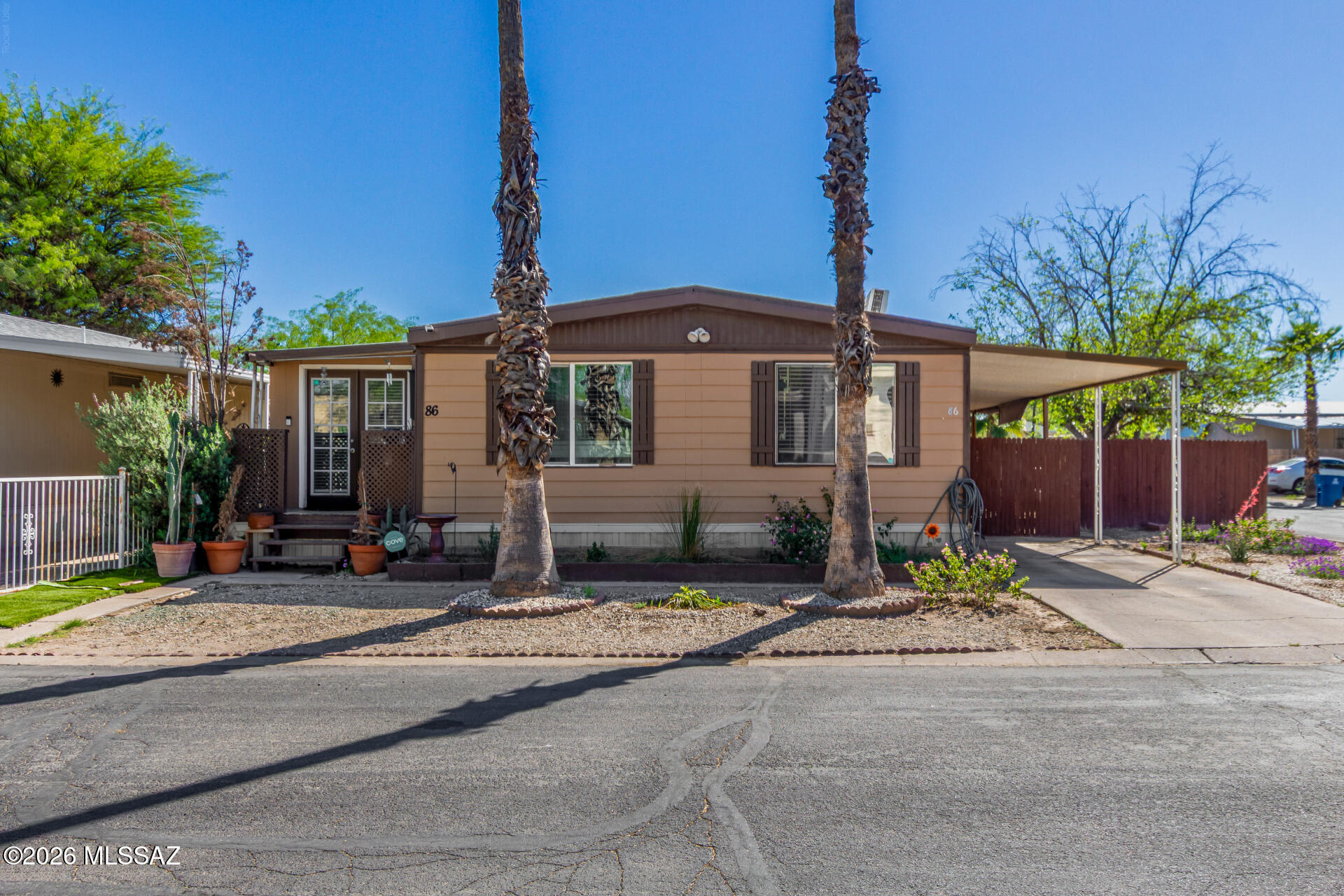 Well-maintained and spacious mobile home, perfect for those seeking comfort, convenience, and an active lifestyle. Located in a well-kept land-lease community, this home offers generous living spaces, a functional layout, and plenty of room to grow--ideal for both everyday living and entertaining. The community itself is packed with amenities designed to enhance your lifestyle. Residents enjoy access to a sparkling swimming pool, relaxing park and picnic areas, a convenient on-site car wash, laundry facilities, and a welcoming clubhouse that hosts gatherings and community events. Situated just minutes from ''A'' Mountain, perfect for the Fourth of July. Whether you enjoy community activities, taking in the mountain views, or heading downtown, this home delivers both comfort and convenience