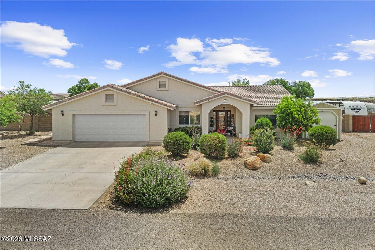Views, Views and more views! Come relax on the back porch and overlook the valley with wide open vistas.  This home is on the upper plateau of the northern side of Safford.  It boasts of tile roofing and well manicured lawns.  The landscaping has new piping that will ensure a beautiful yard with minimal maintenance.  Dont worry about Christmas lighting because a professionally installed system has been installed that you control with a touch of your finger on your phone!  The inside is equally beautiful with unique rounded architecture, tall ceilings, a warm fireplace, and a large gathering area.  You won't want to let this home slip by!  Call for an appointment to walk through today!