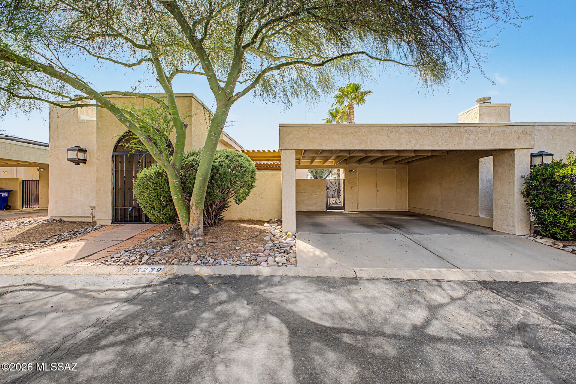 Range price from $299,900-$309,900! Welcome to this inviting townhome in central Tucson's Lazy Creek community, where flexible living spaces and fully paid-off solar add everyday comfort and lasting value. This 2-bedroom, 2-bath home offers 1,250 square feet, including a versatile bonus room ready to fit your needs. Whether you envision a home office, cozy TV room, hobby space, or separate dining area, this additional room gives you plenty of options and the potential to convert it into a third bedroom.

Step inside to a spacious great room filled with natural light, where a wood-burning fireplace creates a welcoming focal point. Tile and laminate flooring run throughout the home for easy care with no carpet. The updated kitchen features KraftMaid cabinetry and generous counter space, providing plenty of room for meal preparation and everyday use. Fully paid-off solar panels provides an added value by helping to reduce electricity costs without an added lease or solar loan payment, especially during Tucson's hot summer months.

Outside, the private backyard features a pergola, paver patio, and plenty of additional space for outdoor seating, weekend gatherings, or simply unwinding. Enjoy access to the community pool along with a convenient location near the Riverwalk, shopping, and dining. With adaptable space inside and room to entertain outdoors, this home offers a comfortable setting to make your own.