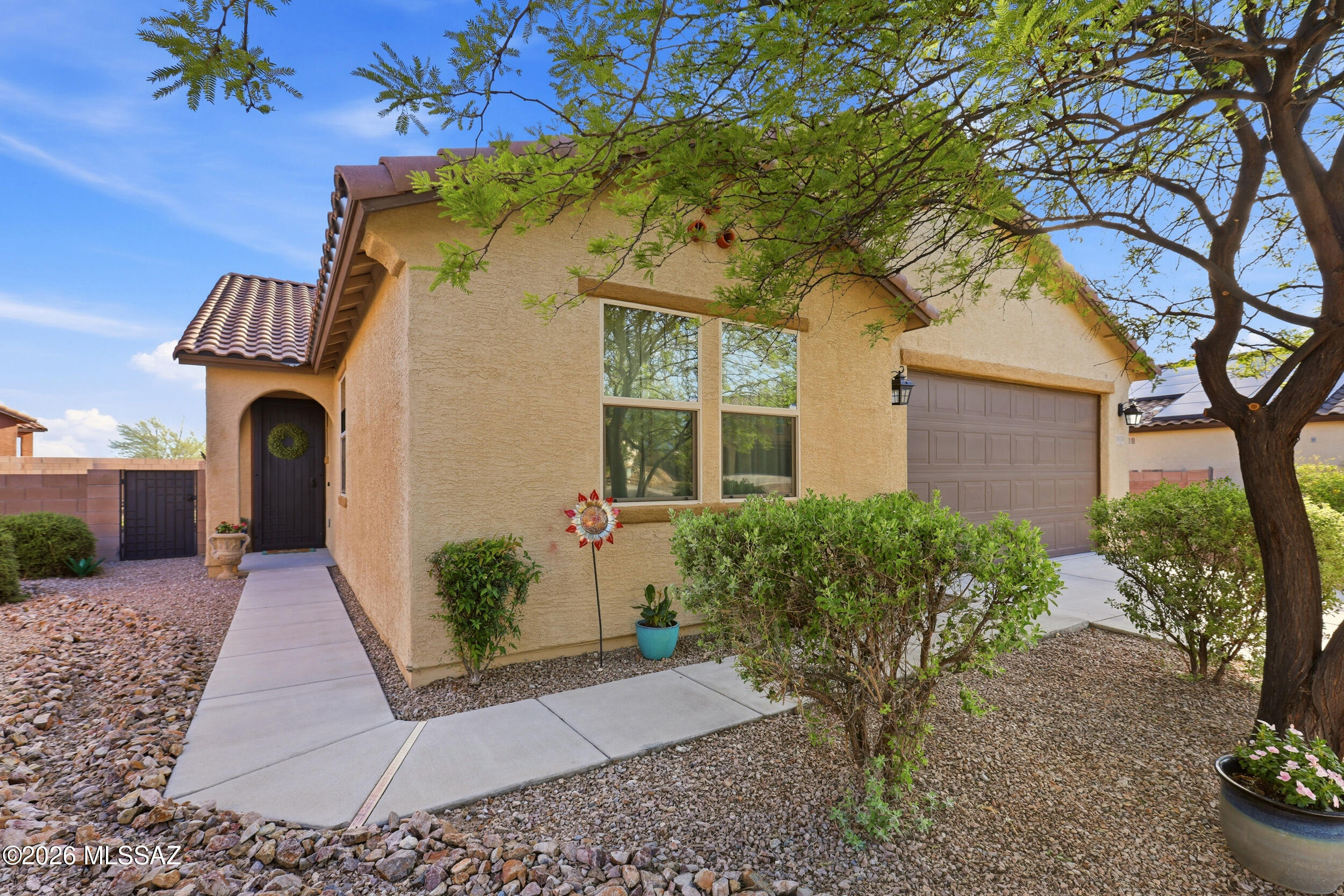 Welcome Home to Elegance and Functionality with this well-appointed 3 bedroom, 2 bath home with a den on a cul-de-sac lot in East Tucson. The upgrades are classy and timeless, featuring high ceilings, tall doors, a gourmet kitchen with granite tops, stone backsplash and SS appliances, and a fully-finished backyard. Built in 2016, this contemporary 2013 SF home is fabulous for entertaining guests in the spacious great room with a kitchen island that can accommodate large gatherings. The den is separated from the great room by a long hallway, making it a truly versatile secondary living area. Come. See. Stay!