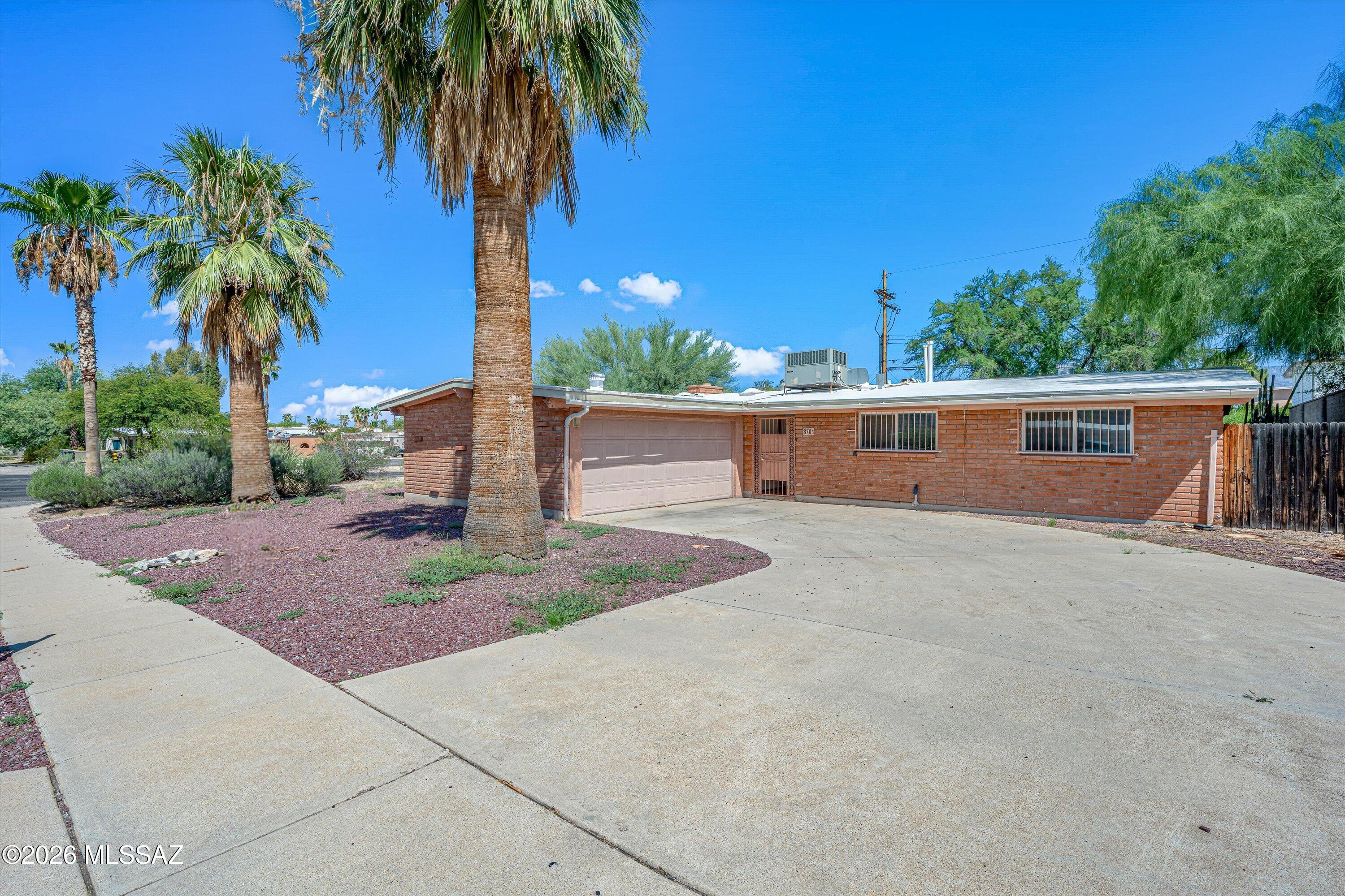 Looking to break into homeownership without breaking the bank? This 3-bedroom, 2-bathroom ranch-style home sits on a corner lot and is packed with authentic Southwest charm, the kind you just can't find in new builds.

Inside, Saltillo tile runs throughout the home (it'll need some love and attention to really shine, but the bones are all there), and a large wood-burning fireplace gives the living space serious character and warmth. A 2-car garage adds everyday convenience, and the shaded backyard is a Tucson rarity, already offering a cool, comfortable outdoor space to enjoy while you make the rest of the home your own.

It needs some sweat equity -- think fresh paint, some updating, a little elbow grease. It's the perfect opportunity for a buyer ready to put in the work and build instant equity, rather than paying a premium for someone else's renovation. If you've been priced out of move-in-ready homes and are ready to roll up your sleeves for a home that's truly yours, this is it.
