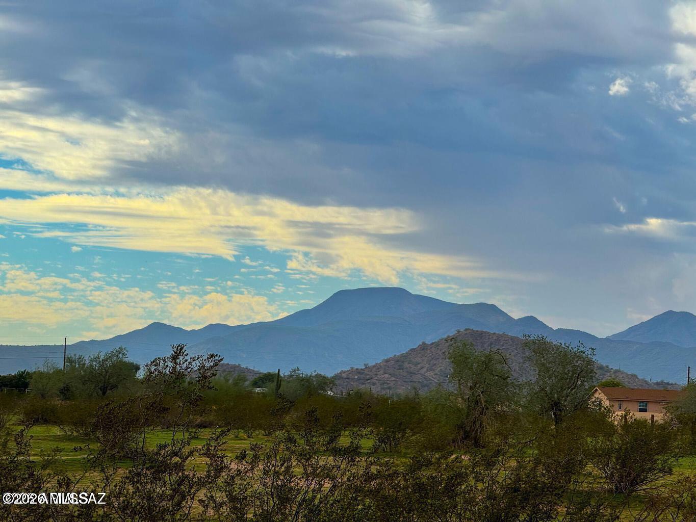 Fantastic, level lot surrounded by mountain views and power at the paved street. Zoned GR, you can build, place a manufactured home, have horses, and live freely and privately with no HOA or CC&R's. Adjacent acreage available.