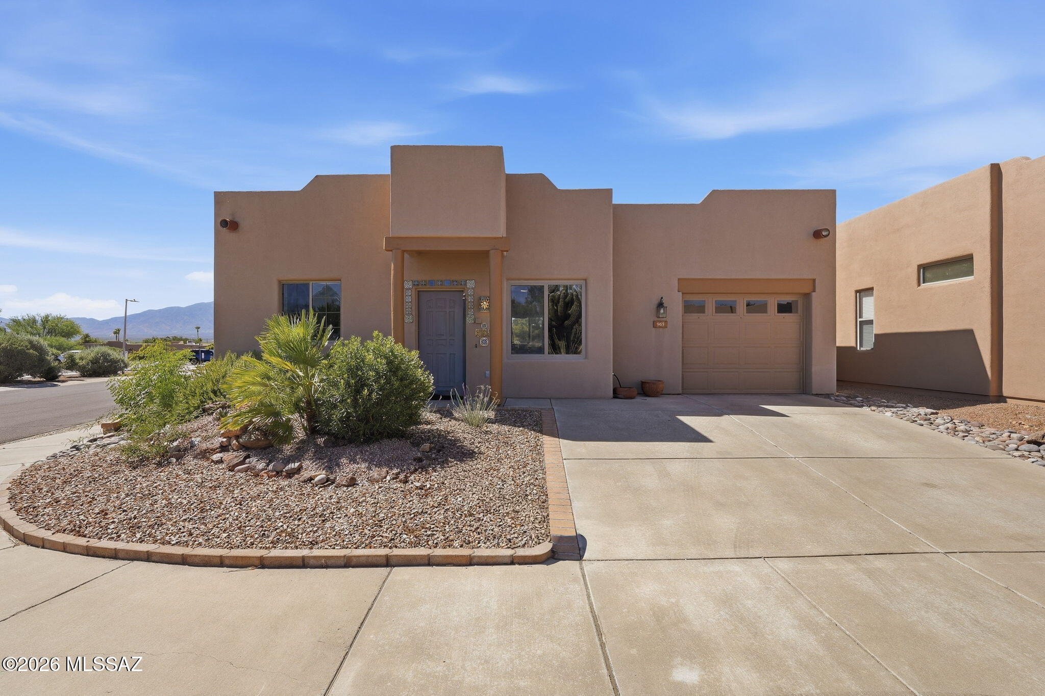 Welcome to a beautifully maintained townhome nestled within the gated community of The Springs in Green Valley. This charming corner lot residence greets you with elegant Spanish tile framing the interior of the front door, setting the tone for what lies beyond.

Inside, you'll find all-tile flooring throughout, creating a seamless and easy-care living experience. The great room features a lovely tiled niche with matching Spanish tile detail, while plantation shutters add a polished touch. The entire interior was freshly painted less than a year ago, giving everything a crisp, move-in-ready feel. The updated kitchen boasts granite countertops, stainless steel appliances, and a lazy susan for added convenience. Just off the kitchen, a gorgeous Arizona room -- not included in the square footage offers stunning mountain views through a slider leading to the backyard, where a pergola and fountain create a peaceful retreat.

The primary bedroom is generously sized, featuring a relaxing soaking tub with a shower above and a skylight filling the space with natural light. The guest bath includes a shower, and both bathrooms have updated sinks. A dedicated laundry room provides extra storage and a door separating it from the main living area. 

Two driveway parking spots complement the garage, which includes additional storage space. The roof was recoated three years ago, and the heating and cooling system is just four years old.

Directly across the street, the recreation center offers a large pool, glass blowing studio, clay studio, and so much more. Come see this gem for yourself.