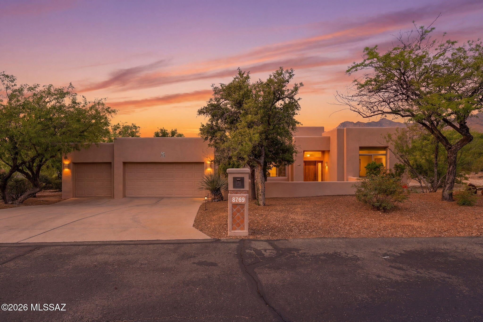 Immaculately maintained home in a small enclave in Tanque Verde Valley, set on a quiet cul-de-sac with spectacular Catalina Mountain views. This .827-acre parcel is located just minutes from Bear Canyon Trailhead and the Coronado National Forest, offering year-round recreation, while shopping, dining, services, golfing, & parks are also nearby. The north-facing enclosed backyard features low-care landscaping with mature vegetation, irrigation, and lighting. Enjoy the large, covered patio while soaking up the views. An inviting entry courtyard and a fabulous Alder entry door welcomes you to this split-bedroom plan with 3 bedrooms, 2 baths, high ceilings, abundant windows and skylights, formal dining room, great room, and casual dining area. The 3-car garage completes the perfect package. THE PROPERTY
> Desirable Tanque Verde Valley Location
> Small Enclave of Homes 
> .827 Acre Parcel on a Quiet Cul-De-Sac 
> Spectacular Catalina Mountain Views
> Minutes from Bear Canyon Trailhead in the Coronado National Forest with Year-Round Outdoor Recreational Opportunities
> Near Shopping, Dining, Services, Golf, and Parks
> North-Facing Enclosed Backyard
> Low-care Landscaping with Mature Vegetation, Irrigation, and Lighting
> Entry Courtyard with Flagstone Patio Area 

THE HOME 
>Immaculately Maintained
> 2,348 Square Feet of Living Area
> 3 Bedrooms and 2 Bathrooms with Toto Toilets
> High Ceilings with Lots of Windows and Skylights
> Amazing Knotty Alder Entry Door
> Formal Dining Room
> Great Room and Casual Dining Area Off Kitchen
> Corner Natural Gas Fireplace in Great Room
> Granite Tile Counters in Kitchen
> Updated Cabinetry
> Newer Stainless-Steel Appliances
> Natural Gas Range
> Second Electric Oven
> Split Bedroom Plan
> Spacious Primary Suite with Walk-in closet, Two Vanities, Corner Garden Tub, and Walk-in, Tiled Shower
> Extended Covered Patio
> Laundry Room with Sink and Desk 
> Desk Unit in 3rd Bedroom Conveys
> Spacious 3-Car Attached Garage 
> Water Softener