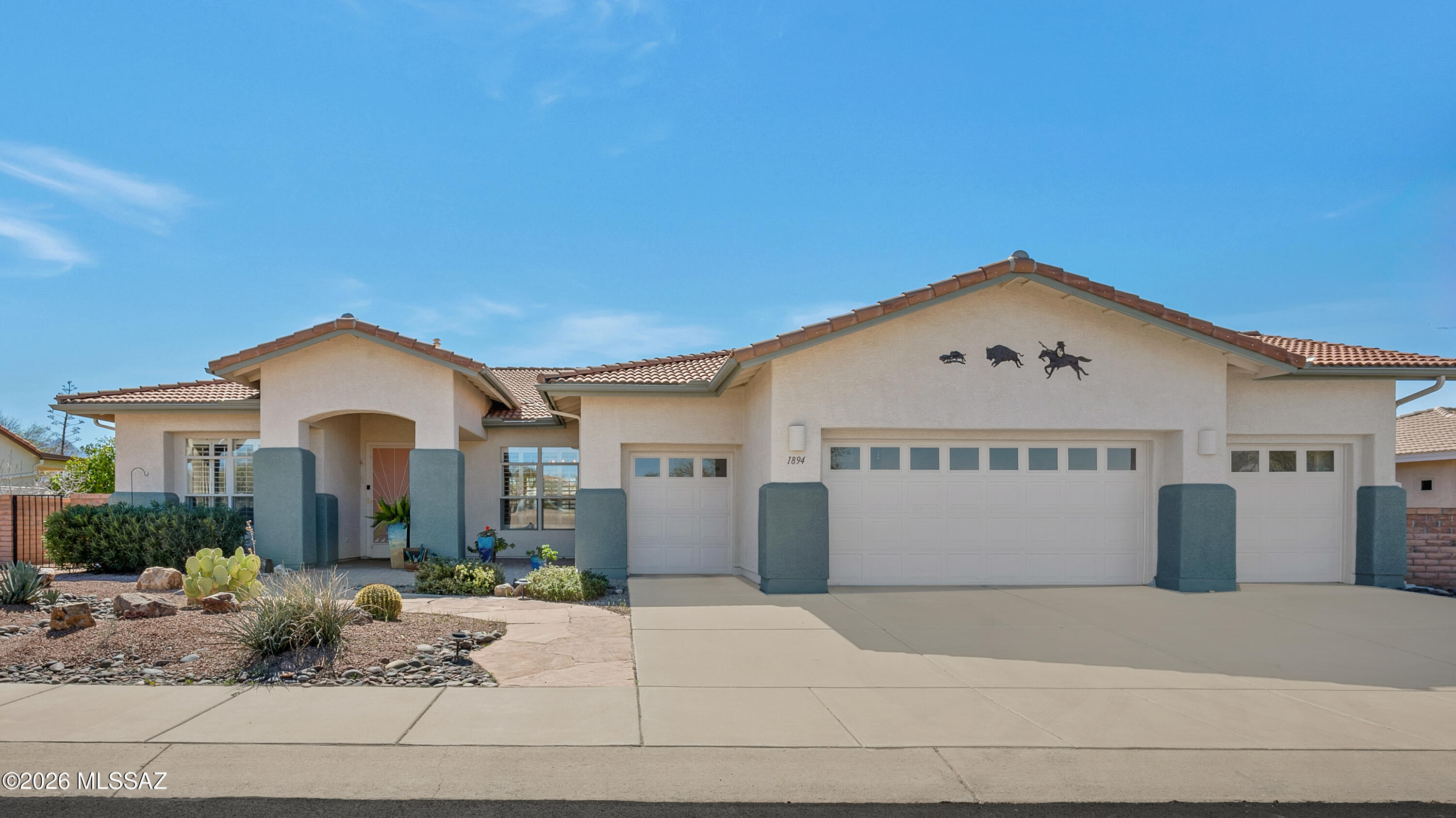 Welcome to refined desert living in the prestigious guard-gated community of Quail Creek Country Club, ideally positioned along the 9th hole of the Quail Course. Perfectly set on a premium golf course lot, this immaculately maintained 2,193 square foot residence offers a rare blend of sweeping fairway views and exceptional privacy - allowing you to enjoy the beauty of the course without sacrificing seclusion. Built in 2001 and thoughtfully designed with a desirable split-bedroom floor plan, this home features two spacious bedroom suites, 2.5 baths, and a versatile den ideal for a home office, hobby space, or additional guest accommodations. From the moment you arrive, the pride of ownership is evident. A charming flagstone paver walkway welcomes you to a covered front patio entry, setting the tone for the elegance found throughout. Step inside to discover expansive open living spaces enhanced by plantation shutters, bay windows, and abundant natural light. The formal dining area flows seamlessly into the great room, where a built-in media center and gas fireplace create a warm and inviting atmosphere -- perfect for entertaining or enjoying quiet evenings at home. The well-appointed kitchen is both functional and stylish, featuring stainless steel appliances, a gas cooktop, pull-out cabinetry for easy accessibility, and generous storage throughout. Whether preparing everyday meals or hosting friends after a round of golf, this kitchen is designed for comfort and convenience. Retreat to the spacious primary suite, complete with a double vanity, soaking tub, walk-in shower, and custom closet system with built-in cabinetry and shelving. The guest suite offers privacy and comfort, ideal for visiting family and friends. Significant recent upgrades provide peace of mind, including a new roof installed in December 2025, newer windows and doors, exterior paint refreshed in recent years, and updated appliances -- ensuring this home is truly move-in ready. Outdoor living is where this property truly shines. The large south-facing covered patio showcases extensive flagstone pavers and a custom kiva-style wood-burning fireplace, creating the perfect setting to enjoy Arizona's stunning sunsets and tranquil golf course backdrop. The oversized three-car garage offers ample space for two vehicles plus a golf cart or workshop area -- ideal for the active lifestyle this community inspires. Living in Quail Creek means embracing resort-style amenities every day. Residents enjoy championship golf, pickleball courts, multiple pools, a state-of-the-art fitness center, fine dining, and a vibrant arts and crafts center -- all within a secure, socially engaged active adult community. Whether you're seeking a luxurious winter retreat or a full-time residence immersed in golf course living, this exceptional home delivers comfort, privacy, and lifestyle in one remarkable package. Opportunities like this along the Quail Course are limited. Schedule your private showing today and experience firsthand what makes this property so special.