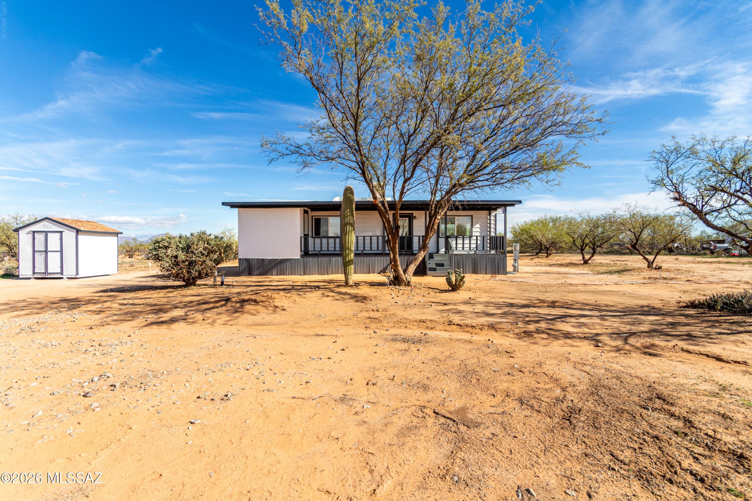 REMODELED 2BR/2BA, on 4.36 ACRES | NO HOA | MOVE-IN READY! Welcome to your own piece of Southwest Tucson! Beautifully remodeled home offers the rare combination of modern comfort, privacy, & room to spread out. Remodeled kitchen features white cabinetry, subway tile backsplash, pantry, new SS microwave & electric range. Bathrooms have been beautifully remodeled, complemented by updated flooring throughout, soft neutral palette, & abundant natural light. New AC to be installed by closing, & roof comes w/ a warranty for added piece of mind. Outside, enjoy mature trees, storage sheds, views, welcoming front porch, & endless possibilities for RVs, recreational toys, horses, pets, gardening, workshops, or simply enjoying your own space. Come see the possibilities! Agent is related to seller.